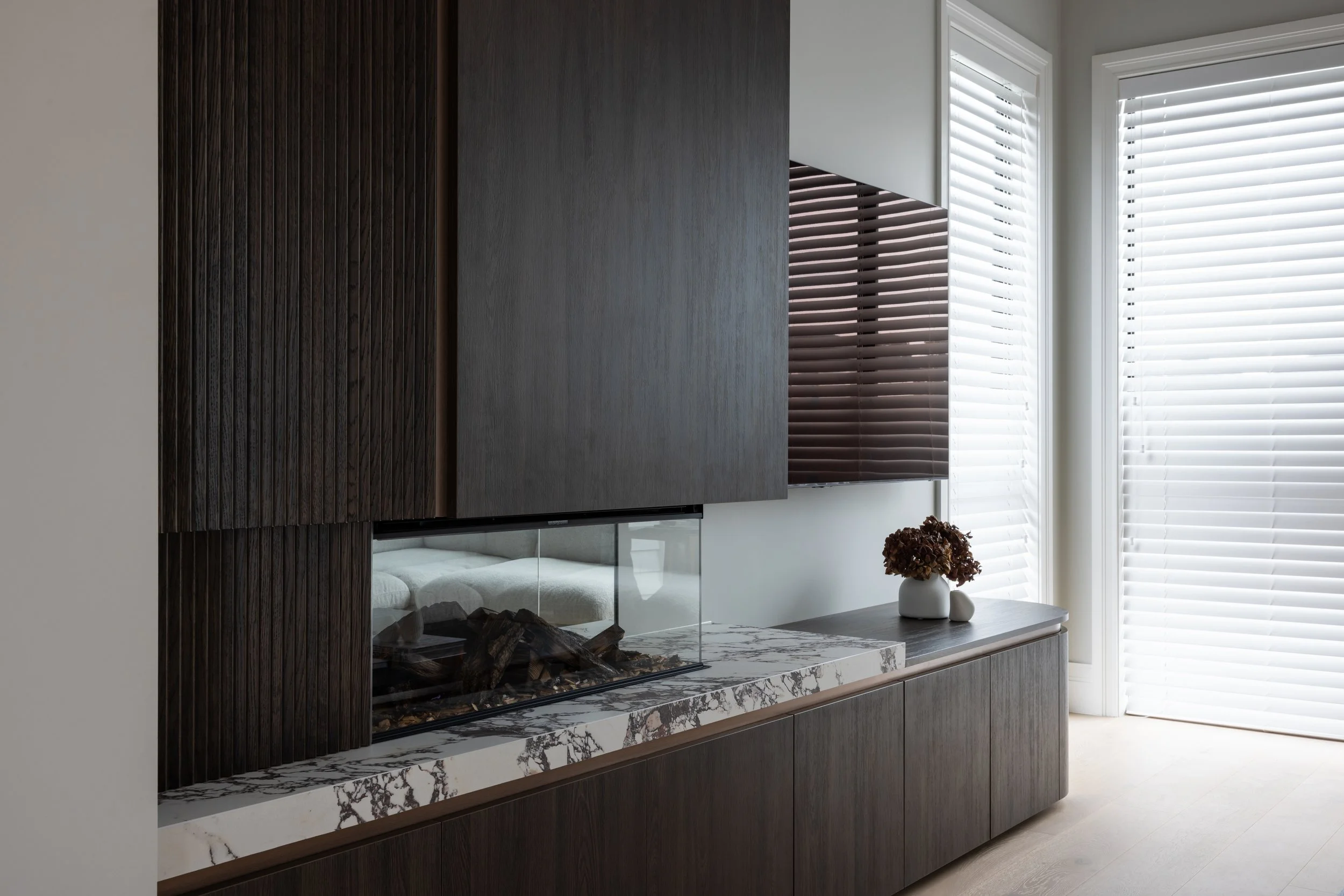Award-winning designer Melanie Sa’u creates an inviting interior anchored by the warmth and texture of Bavarian Oak.