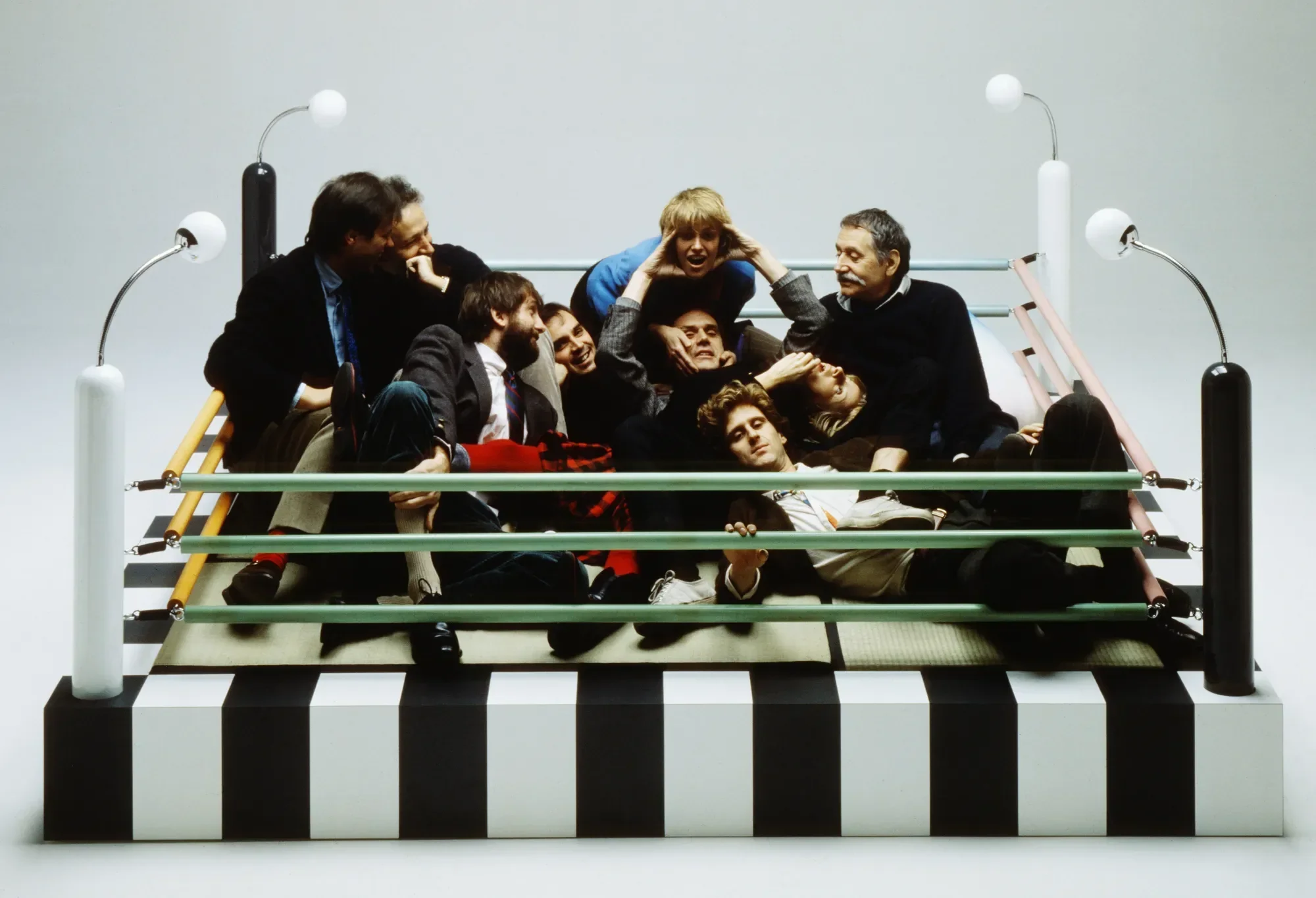 The Memphis team posing on bed Masanori by Umeda Tawaraya, 1981. Curtest of Studio Azzurro / Memphis, Milano / Vitra Design Museum