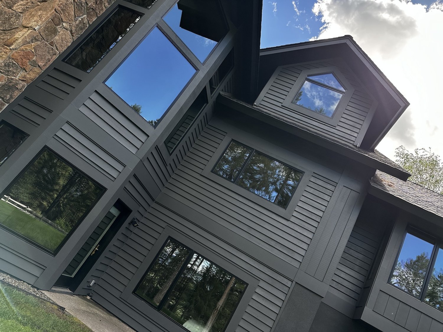freshly exterior painted black house in Whitefish Montana