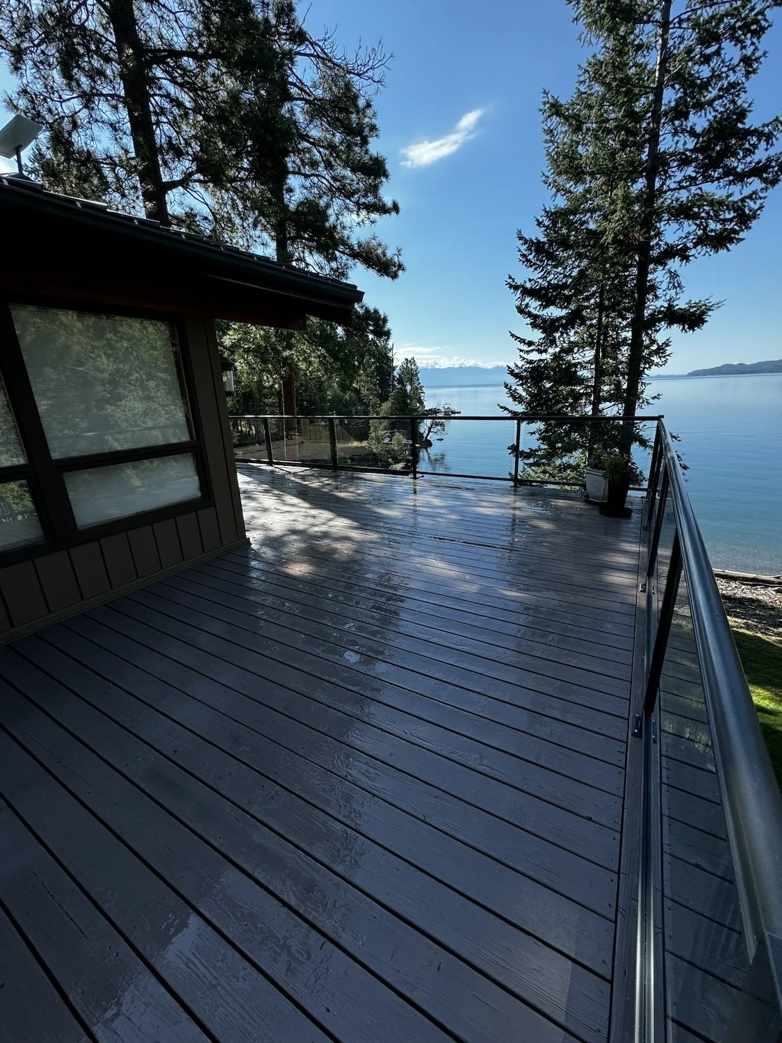 fresh grey deck stain overlooking Whitefish Lake 