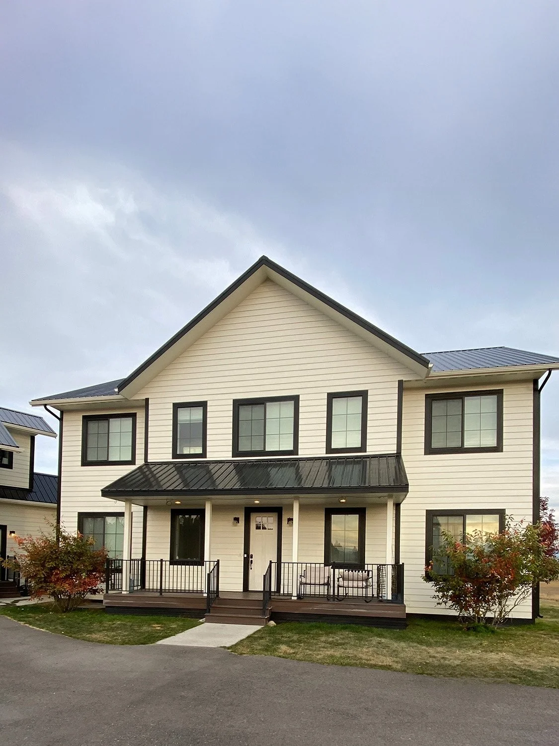 White painted exterior with black trim and roof on Kalispell, MT house