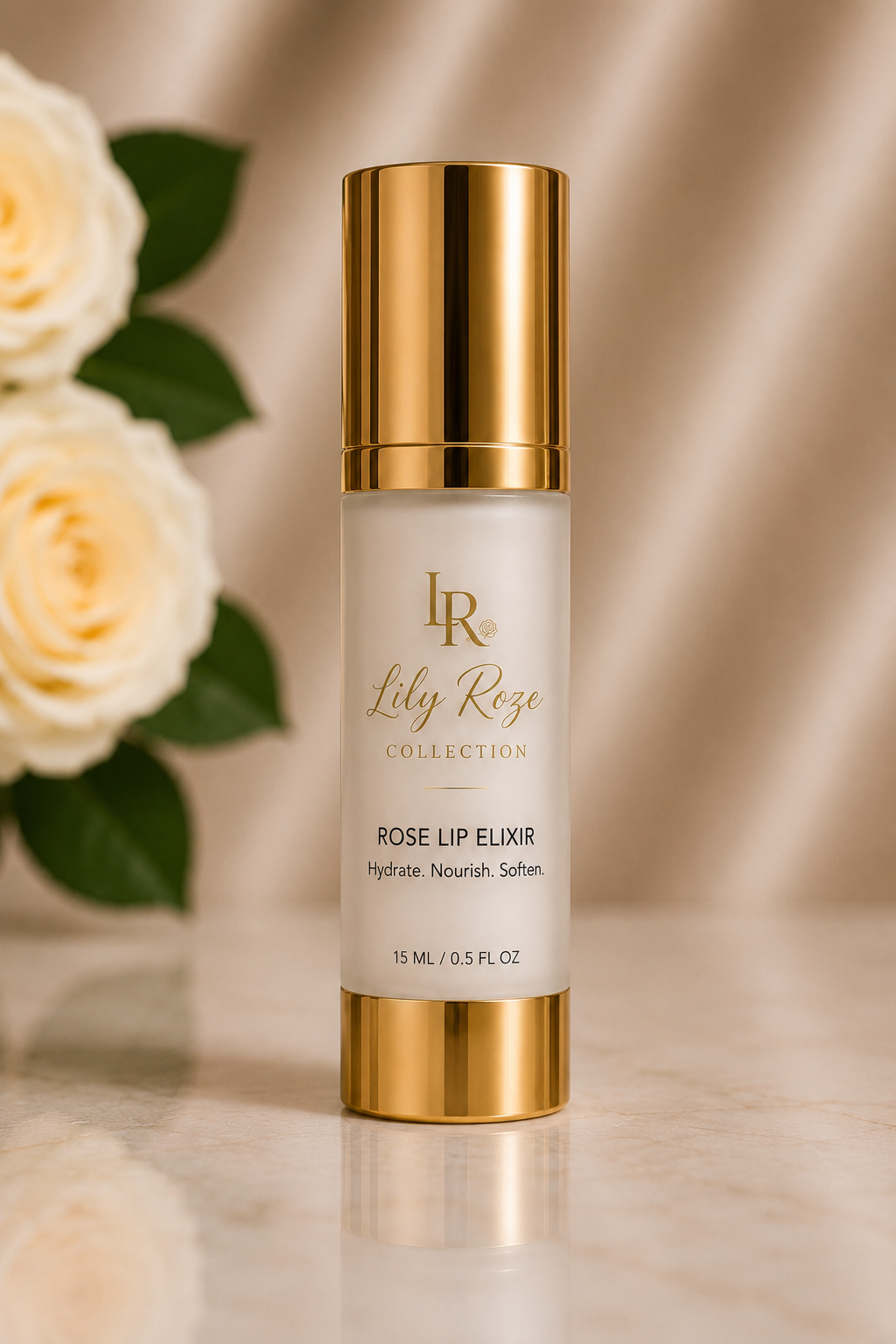 A white bottle of Lily Roze collection Rose Lip Elixir with gold cap and text, set on a marble surface with blurred white roses in the background.