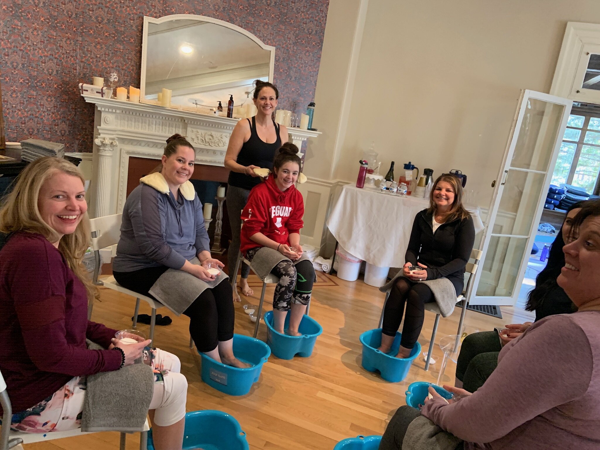 Group of women enjoying a foot spa session