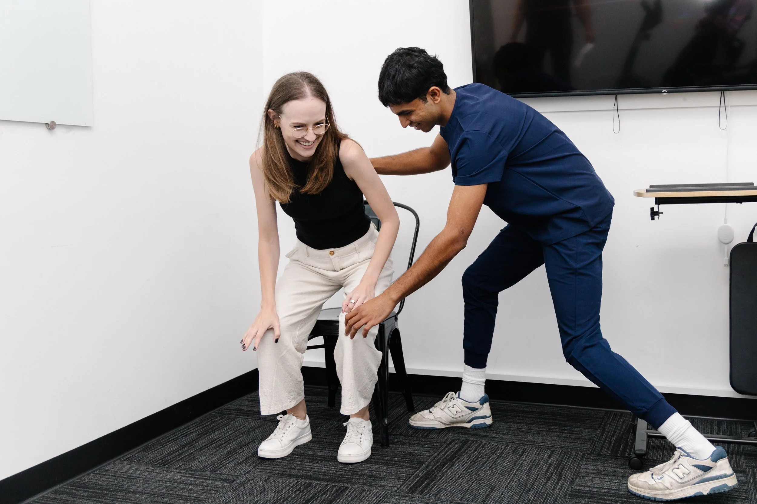 Physiotherapist assisting a patient with a mobility assessment for pain management at Move Right Physio Dakabin