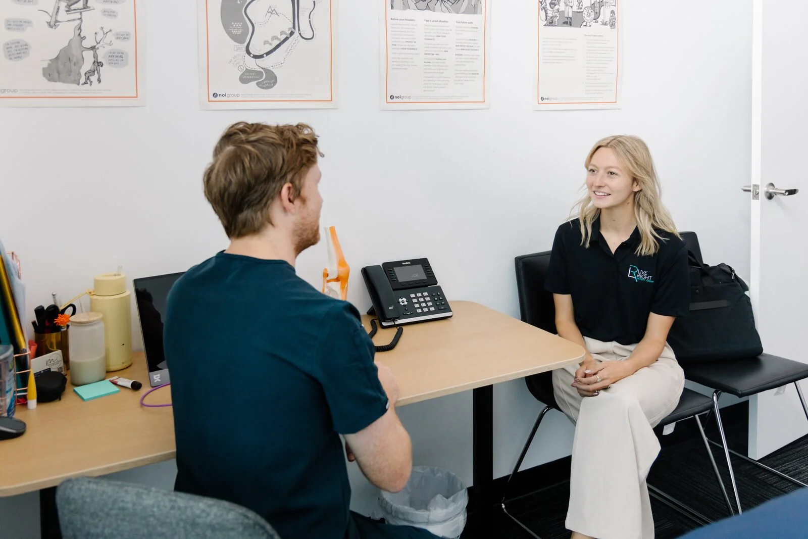 Physiotherapist consulting with a patient at Move Right Physio Dakabin