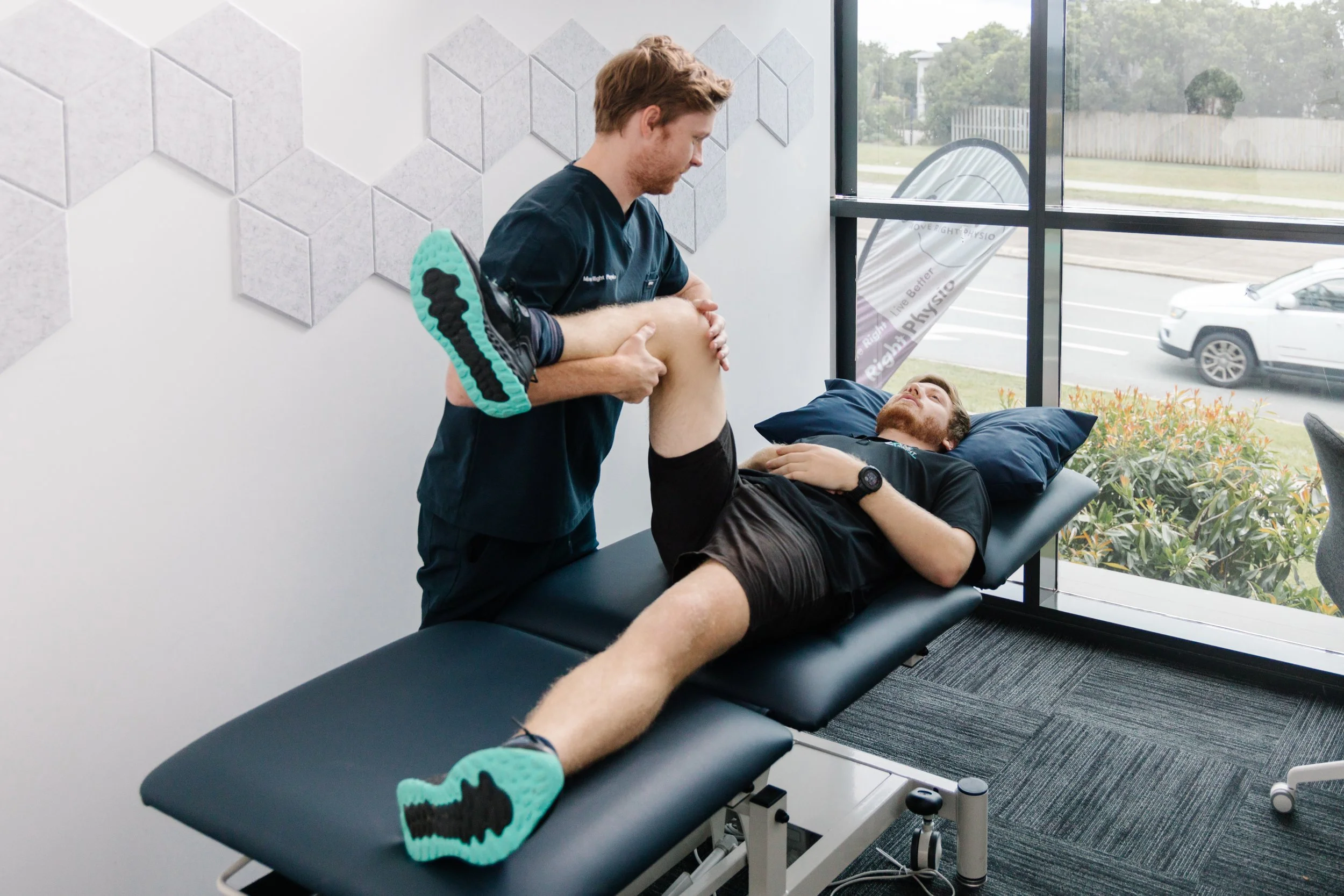 Physiotherapist assessing hip and knee range of motion at Move Right Physio Dakabin