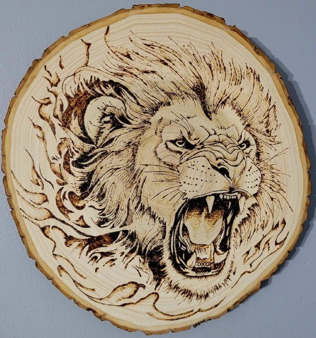 Jadyn Deming.
Feral Feline, 2025
pyrography on wood
9.5" diameter
$160