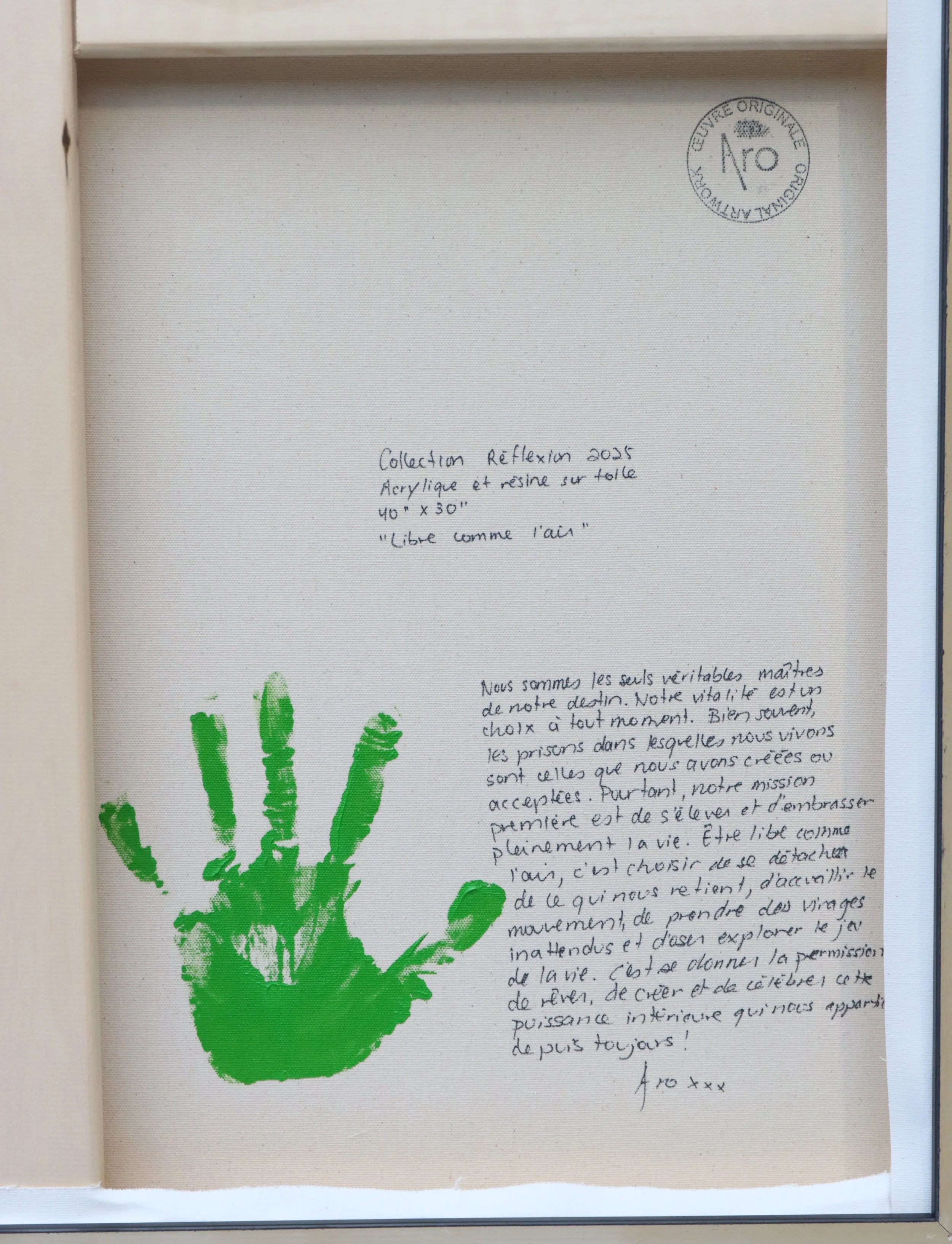 Close up of the writing of Canadian Abstract artist ARO on the back of her painting entitled Libre comme l'air, 2025 acrylic, resin on canvas 40" x 30"