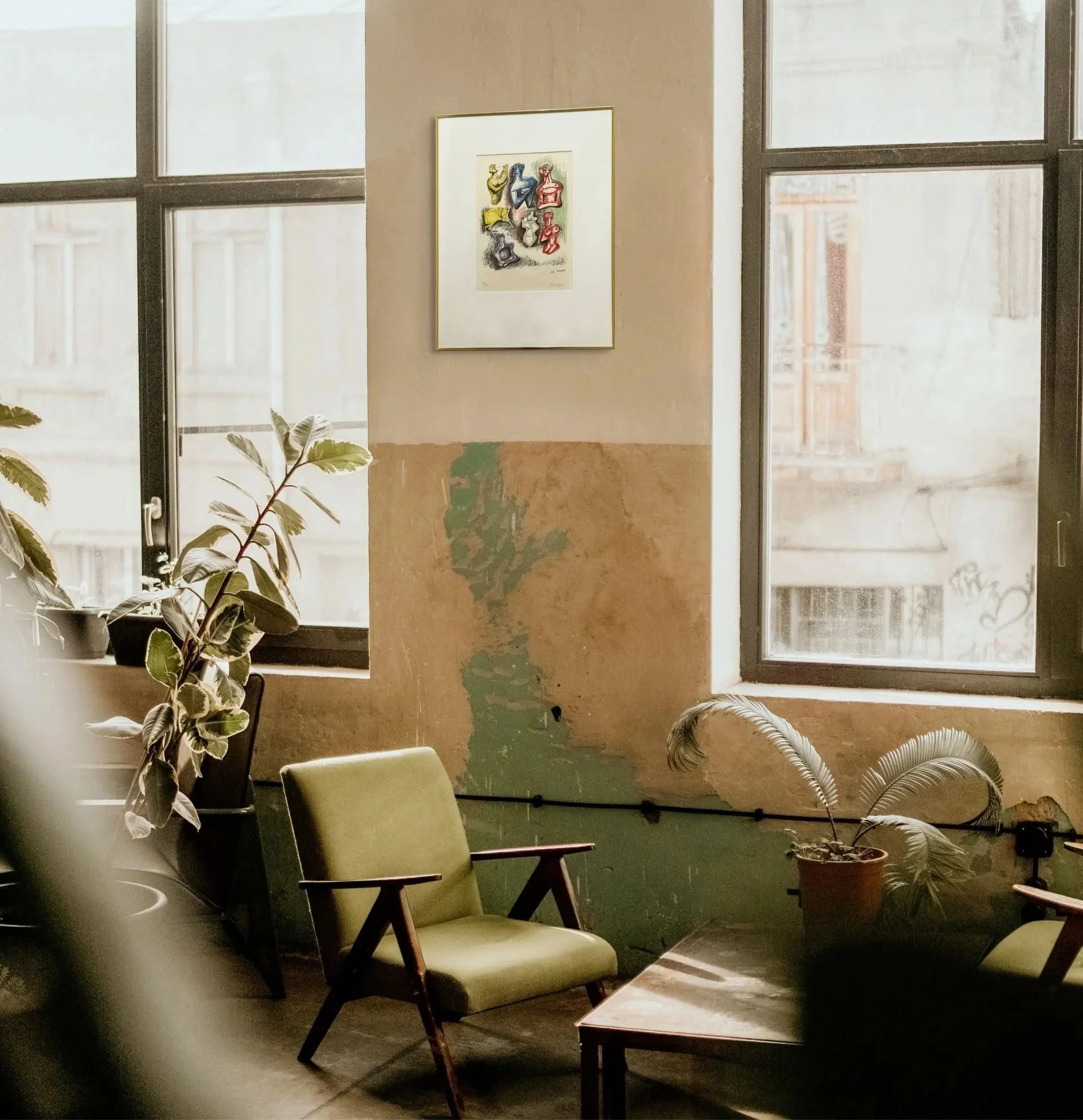 Lithograph of Henry Moore hangs on the wall of a office