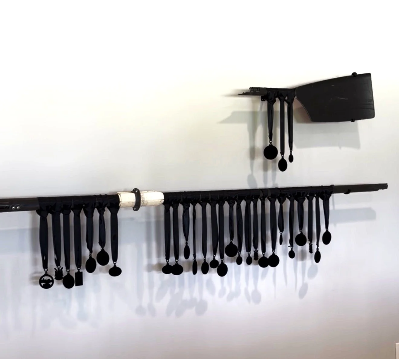 Ana Norton.
Medals, 2026
Sculling Oar, Rowing medals, ribbon, acrylic
~6' x ~4' x 6" (Varies with installation)
$2,000