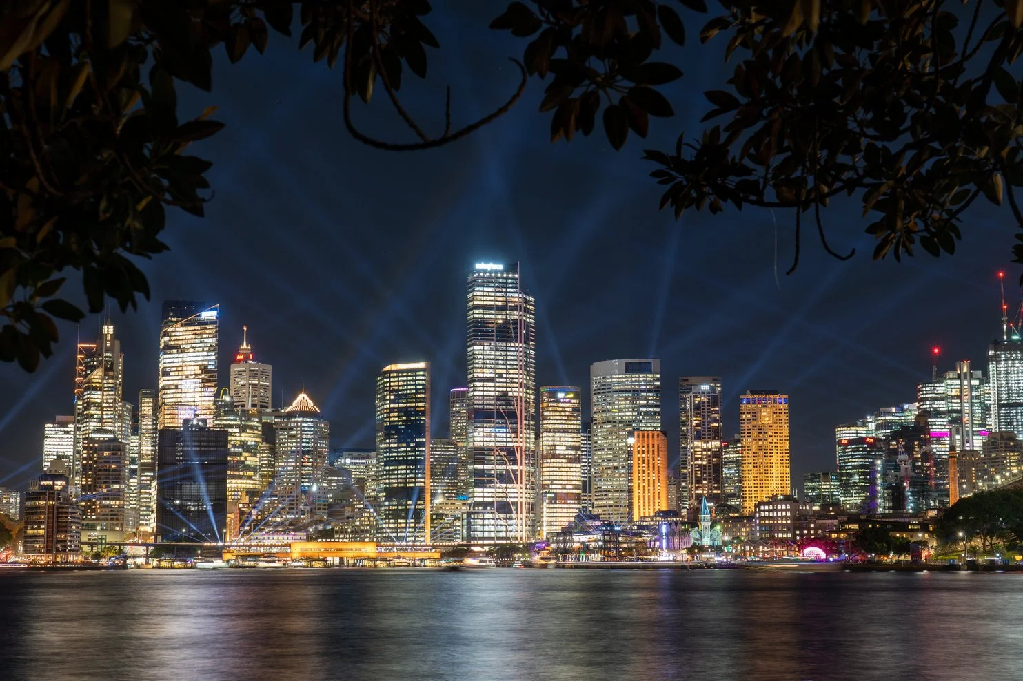 The City of Sydney in AU, Skyscrapers and waterling light up at night , so the stars are not visible