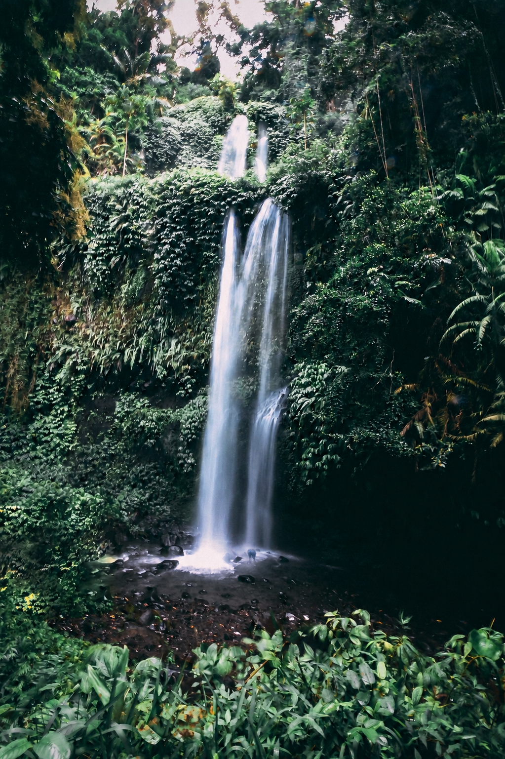 Sendang Gile Waterfall flowing through the rainforest in North Lombok