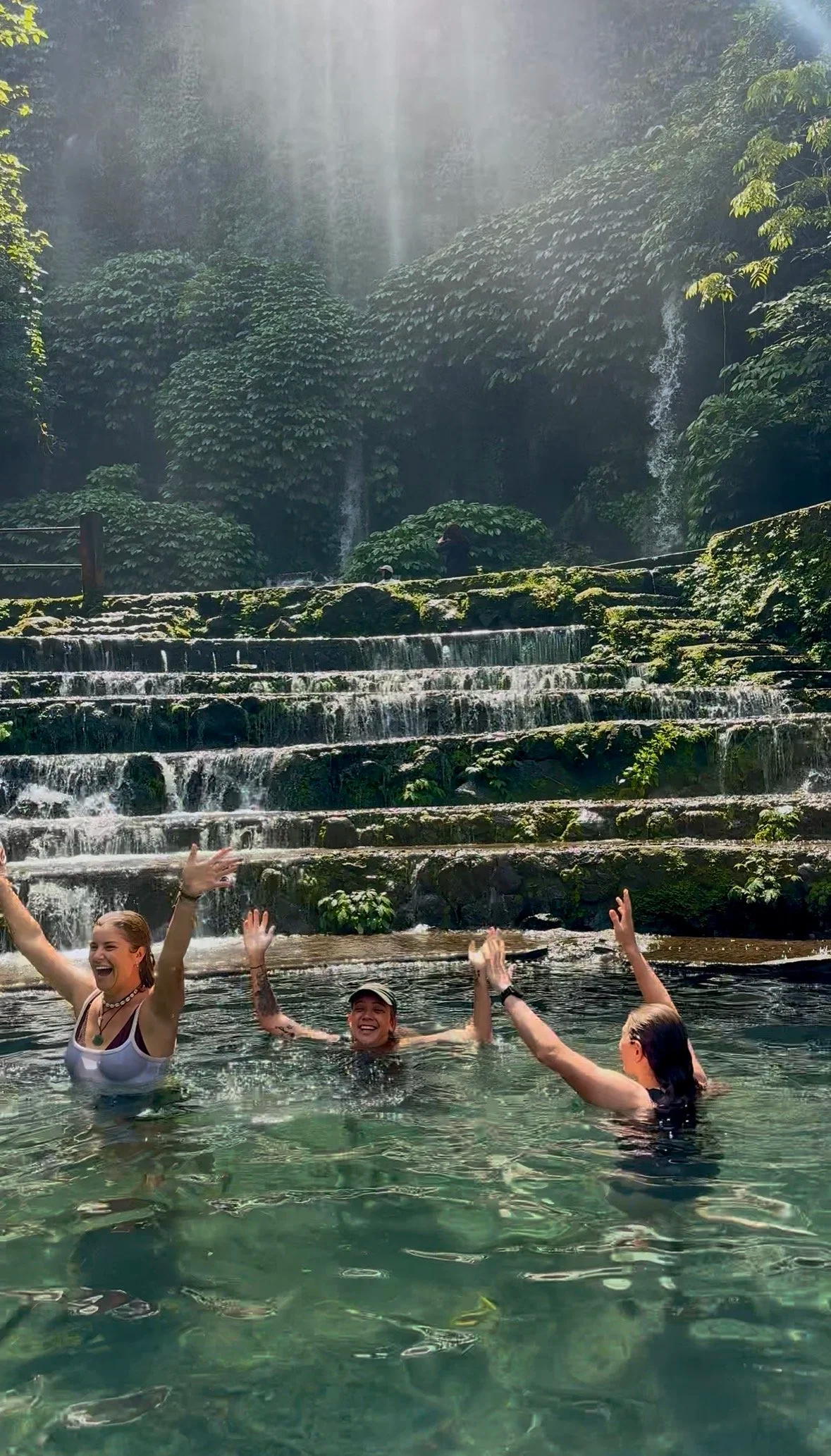Guests enjoying the water at Benang Kelambu Waterfall in Lombok