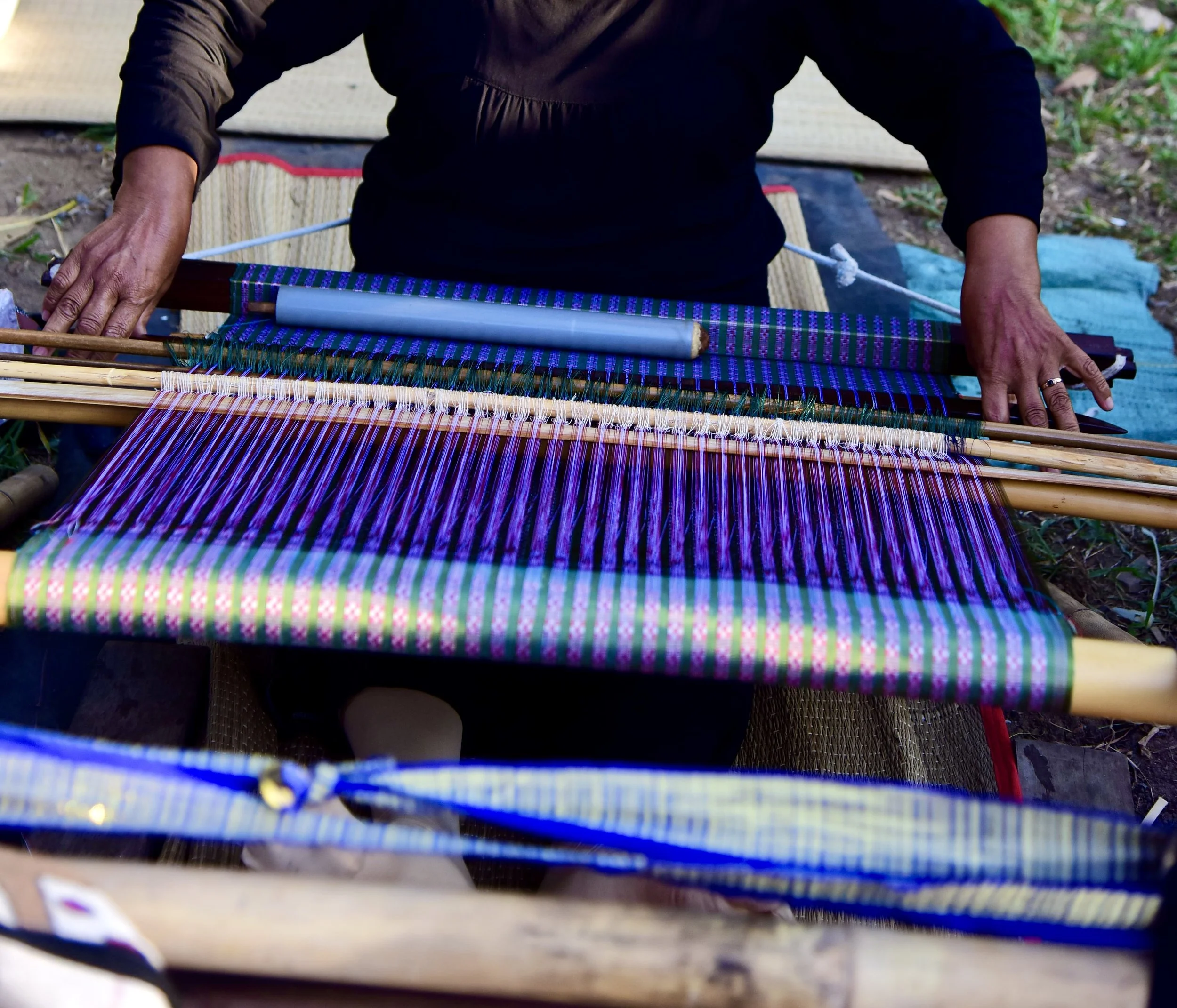 Local artisan creating traditional Sasak weaving in Tetebatu
