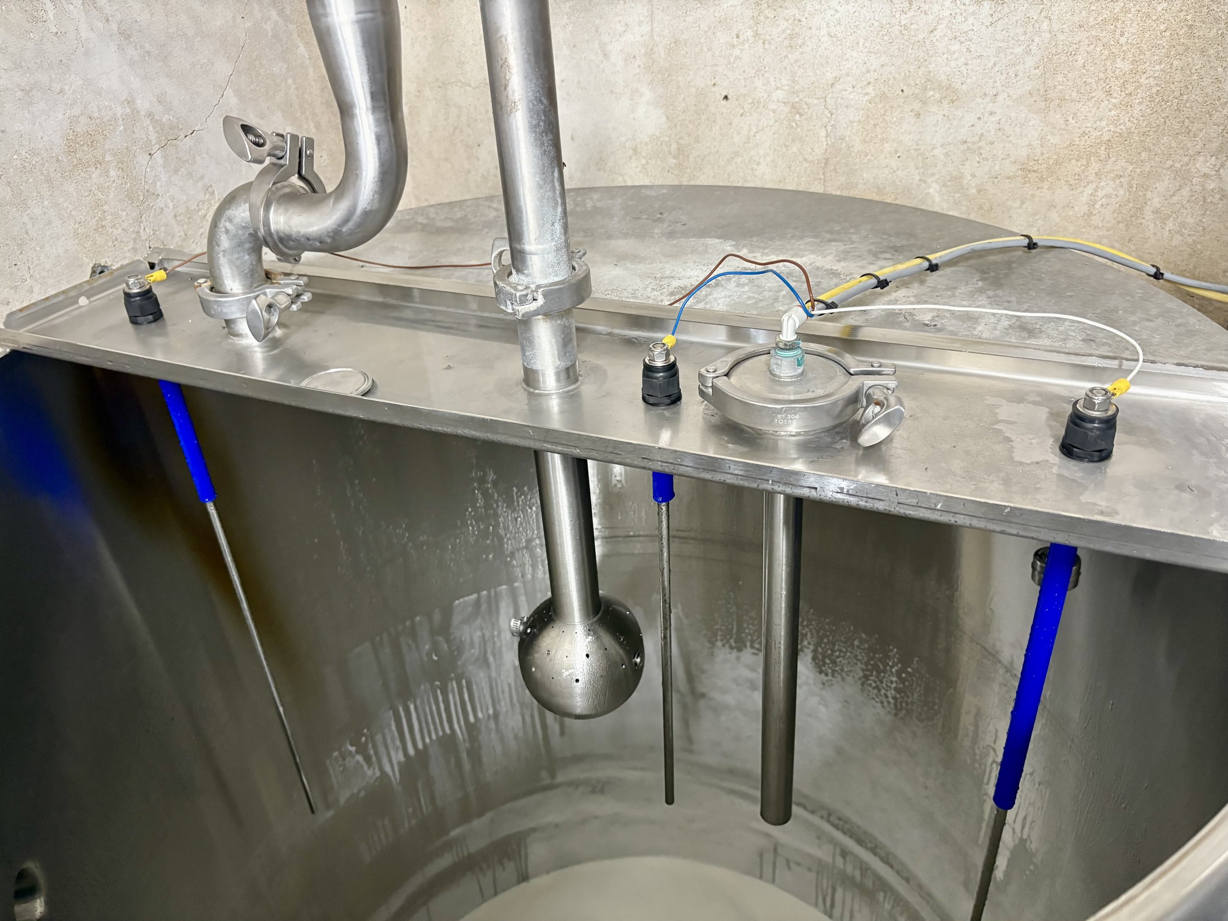 Implementing unique solutions: retrofitted liquid level controls into this vat to optimize cooling and milk flow