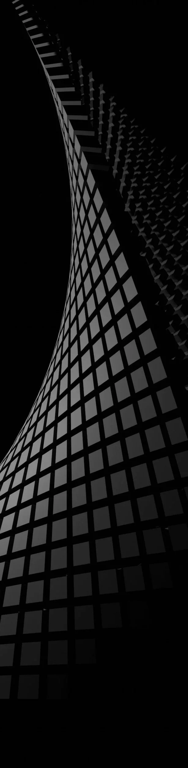 A tall modern building with a curved glass facade, viewed from the ground looking up.
