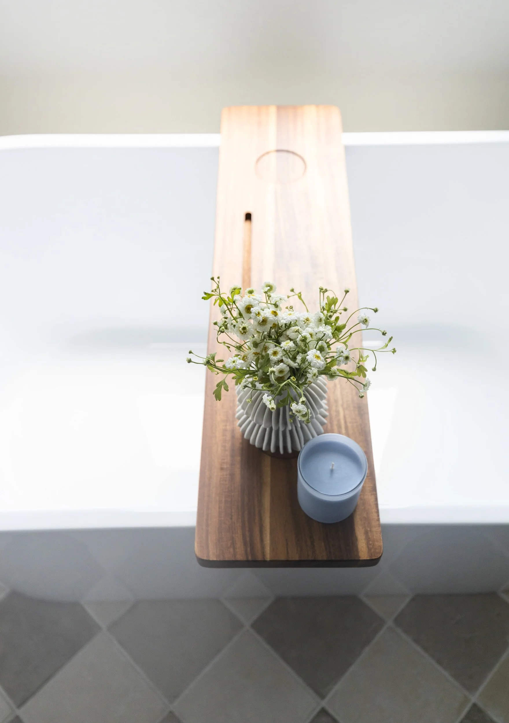 Wood bath tray with flowers across a freestanding tub, Desert Ridge primary bathroom