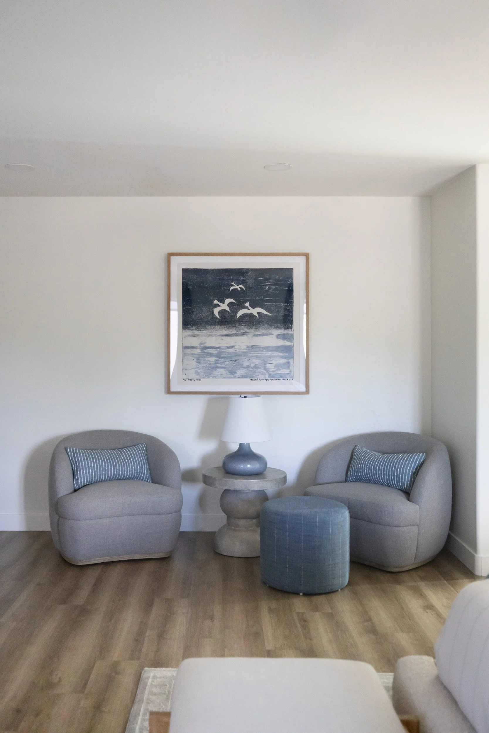 Primary bedroom seating area with two blue chairs, side table and ottoman in Phoenix, AZ