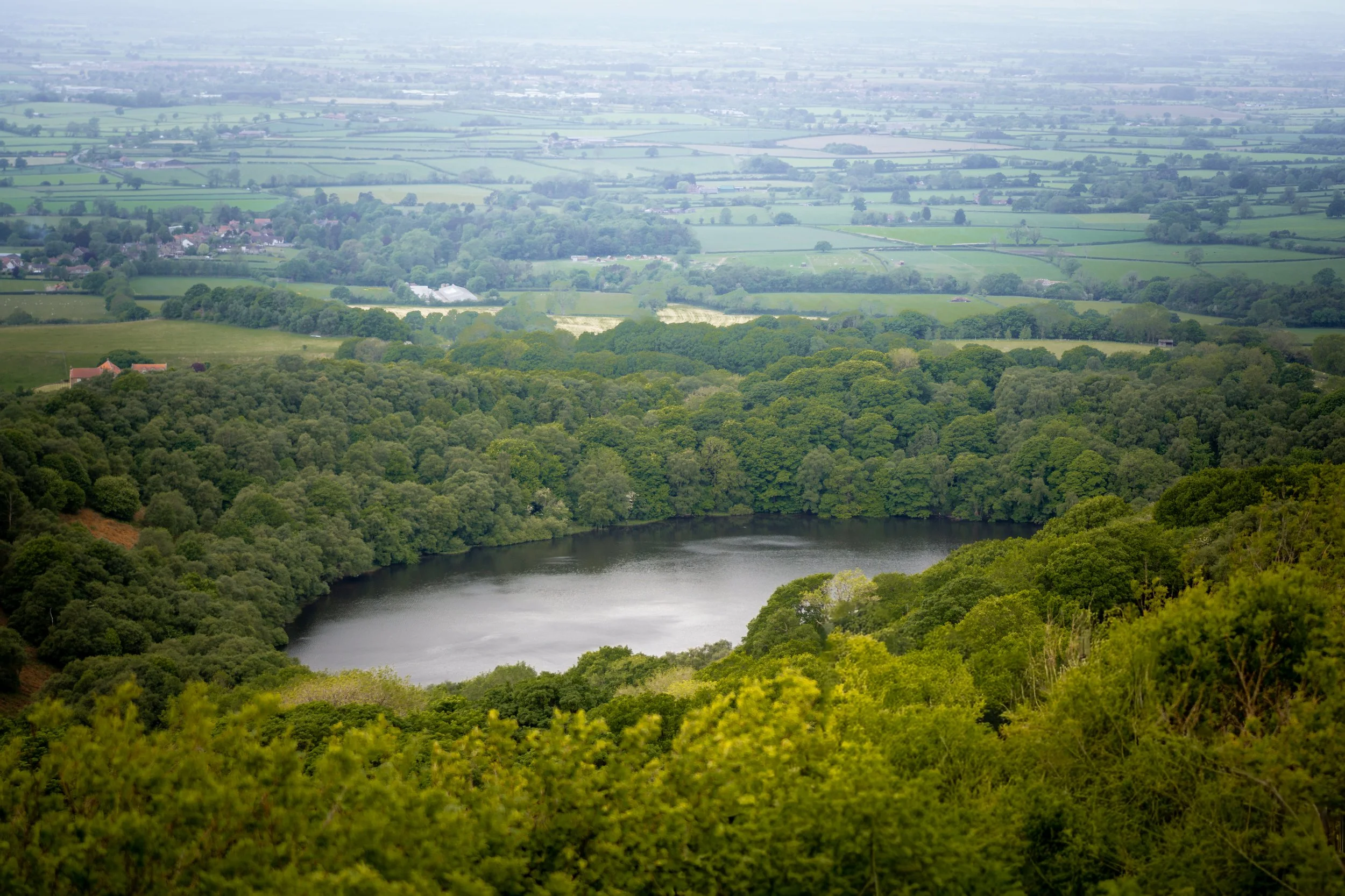 Gormire Lake, associated with the legend of a witch who leaped into it from Whitestone Cliff to escape her pursuers. It's also said to be bottomless, and to be a gateway to the underworld. North Yorkshire.