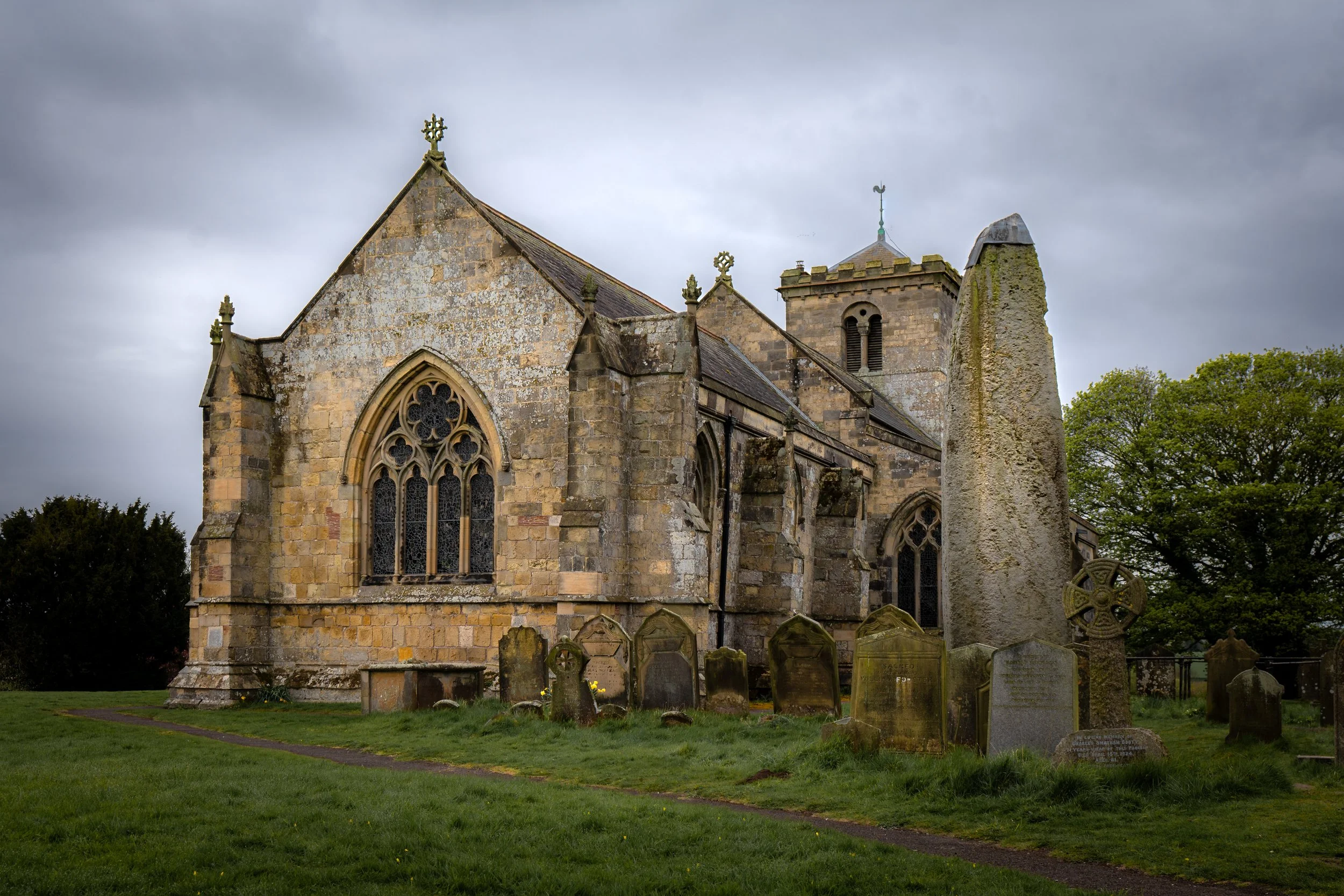 The Rudston Monolith, the UK’s tallest standing stone in the somewhat unlikely setting of a parish churchyard. Rudston, East Riding of Yorkshire.