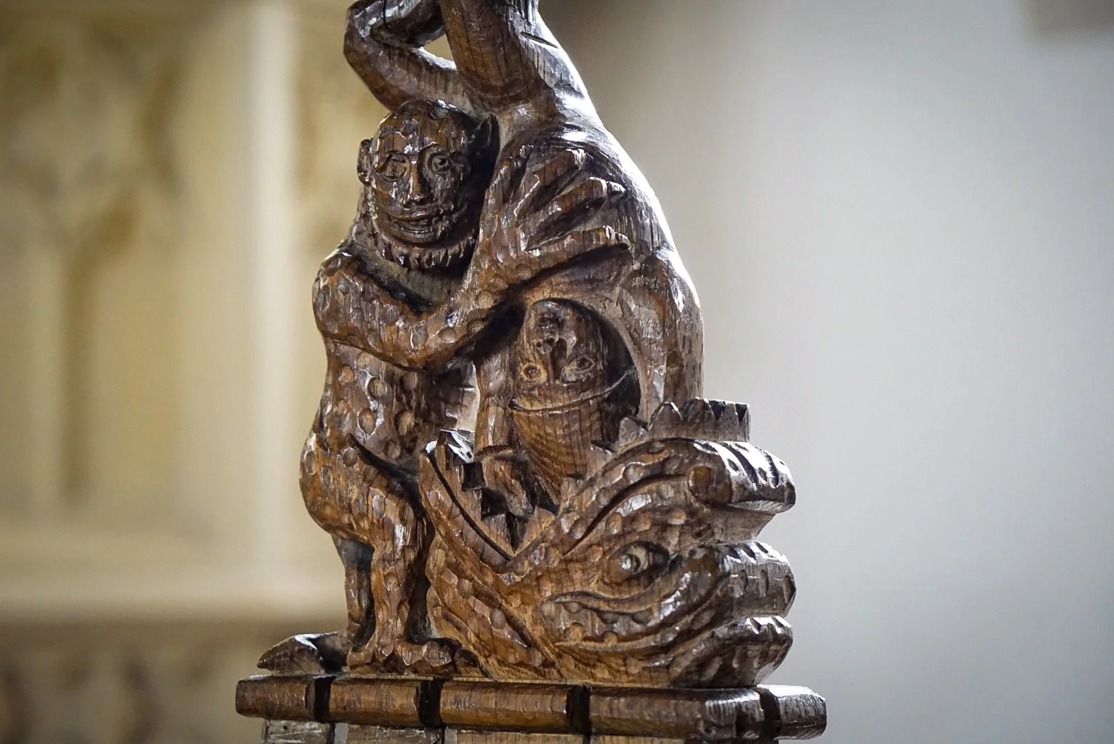 A demon despatching a sinner through the jaws of hell. St Andrew, Freckenham, Suffolk.