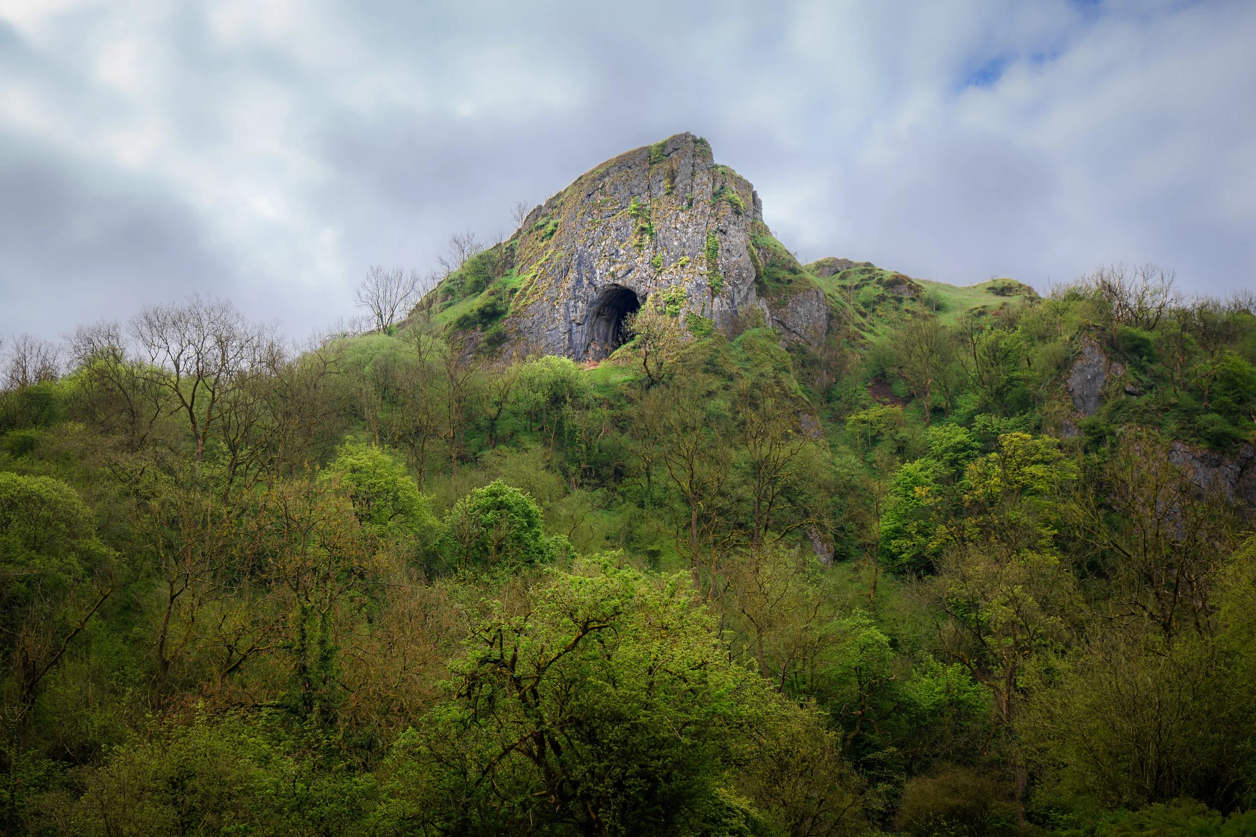 Thor's Cave in the Manifold Valley, an imposing cavern sometimes claimed to be the entrance to a fairy kingdom. Wetton, Derbyshire.