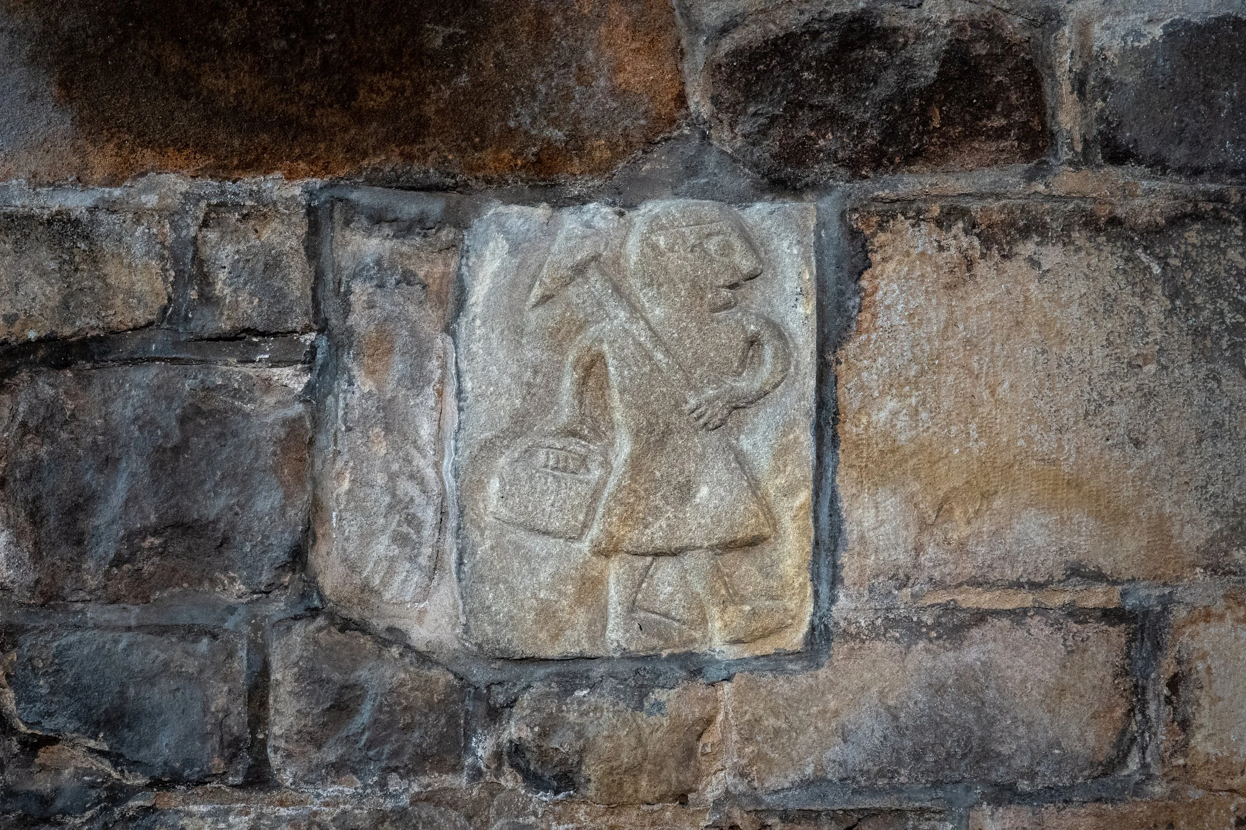 Medieval carving of T'Owd Mon (The Old Man), the protective spirit of generations of Peak District miners. St Mary, Wirksworth, Derbyshire.
