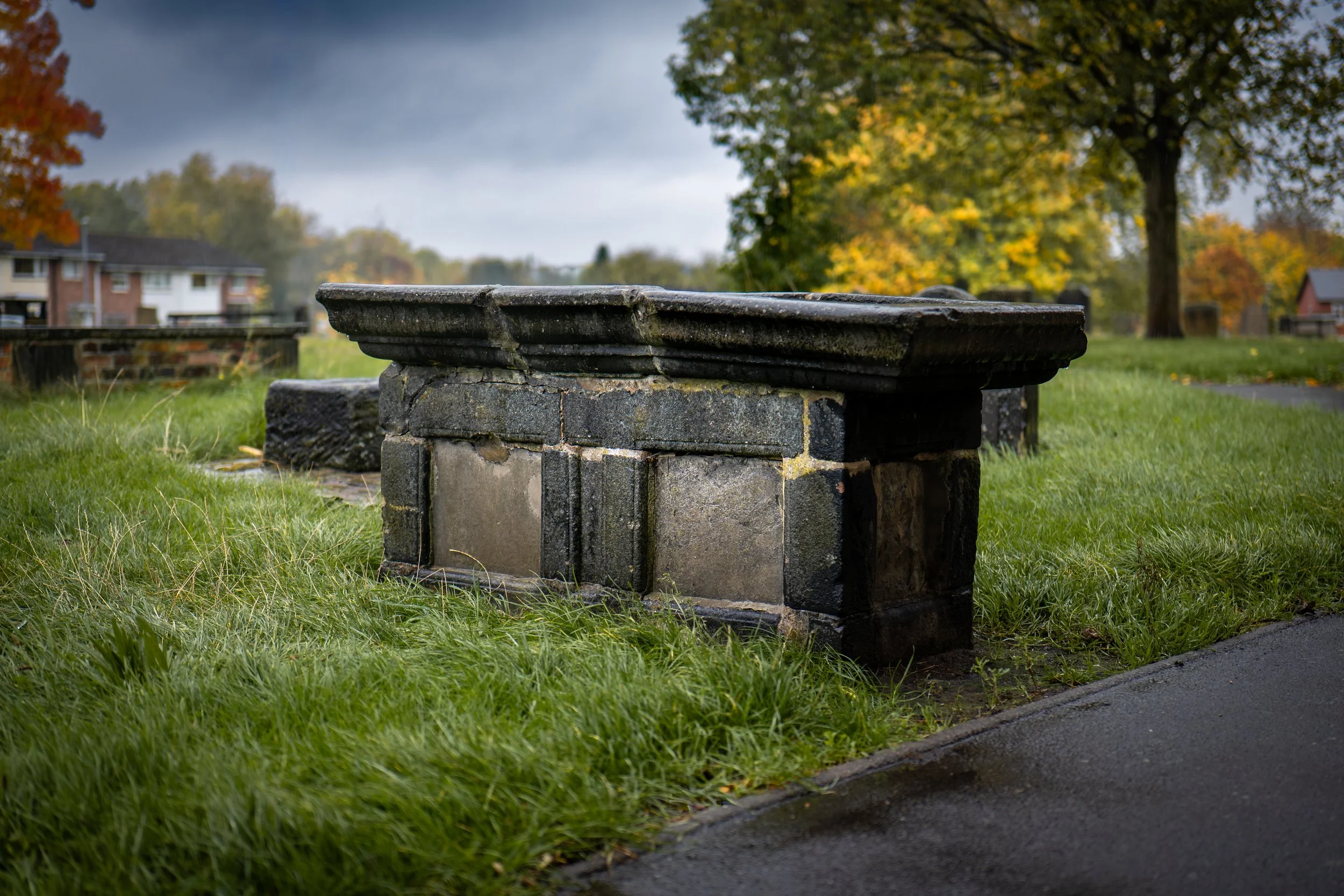 The table tomb of seventeenth-century cunning woman Margaret 'Molly' Leigh, aligned in a north-south direction to appease the restless soul of the deceased. St John the Baptist, Burslem, Staffordshire.