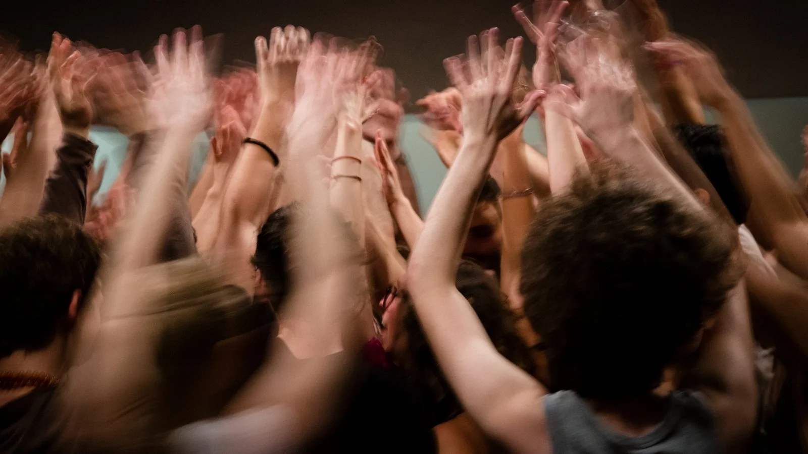 Gay men in a closing circle after an ecstatic dance event, sharing their experiences