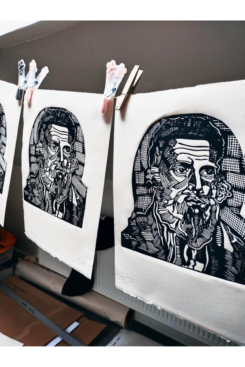 Space-saving DIY drying line with freshly pulled linocut prints