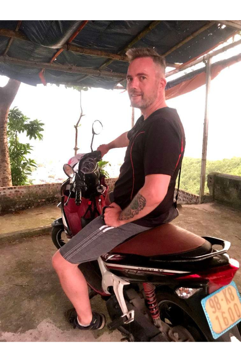 Artist and Printmaker on his Scooter in Haiphong, Vietnam