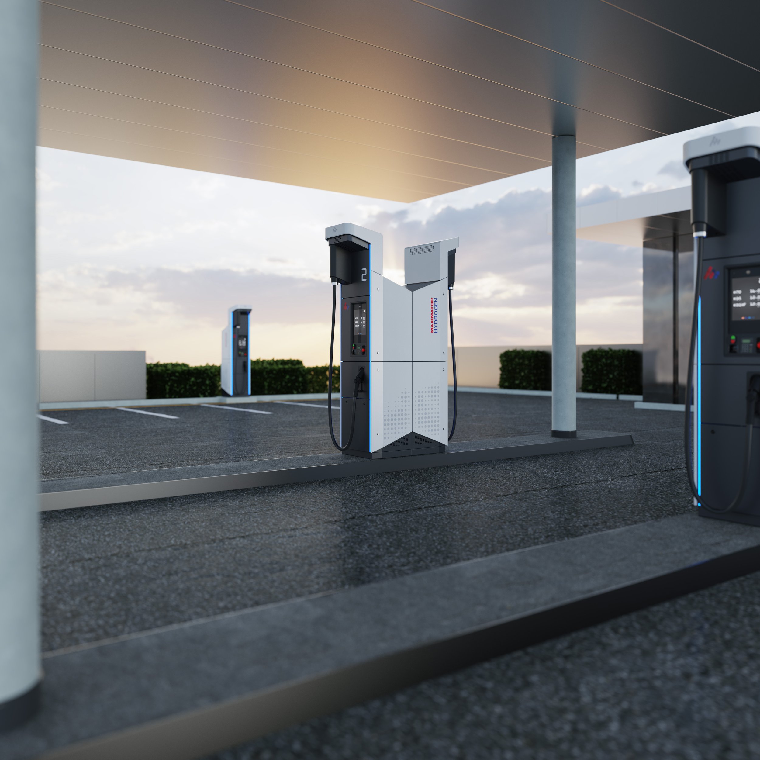 Das Industrial-Design der Maximator Hydrogen Wasserstofftankstelle zeigt eine moderne Zapfsäule mit klarer, weißer Gehäuseform und integrierten Displays, die unter einer Überdachung auf Asphalt steht.