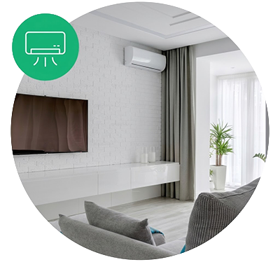 Modern living room with a wall-mounted TV, air conditioning unit, gray curtains, a potted plant, and a gray armchair.