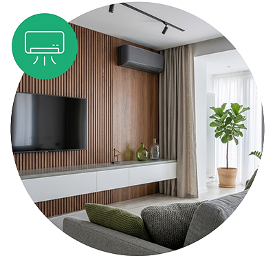 Modern living room with wall-mounted TV, wooden accent wall, white floating console, green decorative bottles, air conditioning unit, beige curtains, potted plant, and gray sofa.