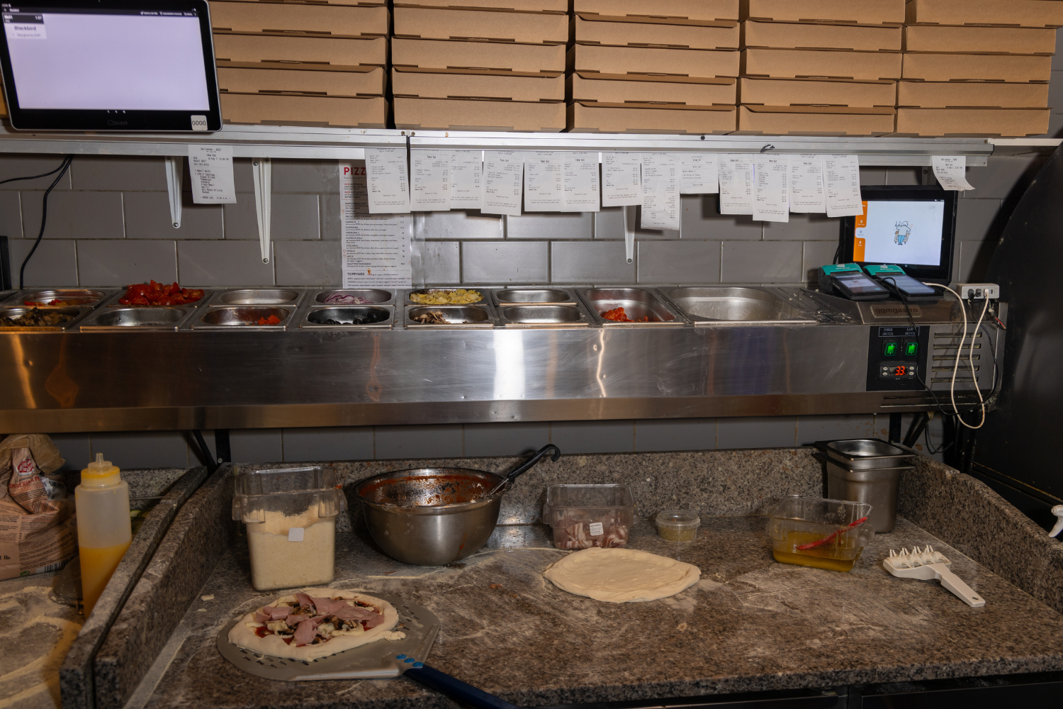 paper ticket orders in the kitchen.png