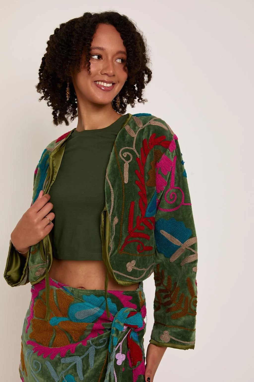 dark green jacket and matching skirt