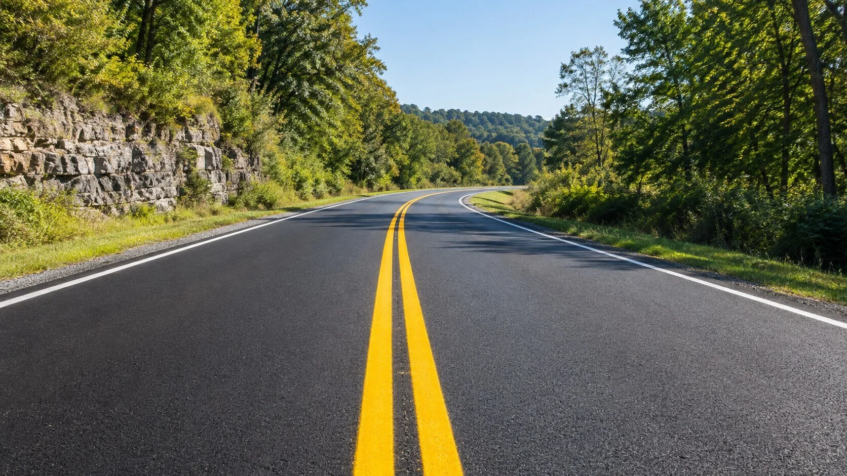 Thermoplastic road striping with double yellow center lines on a Middle Tennessee highway
