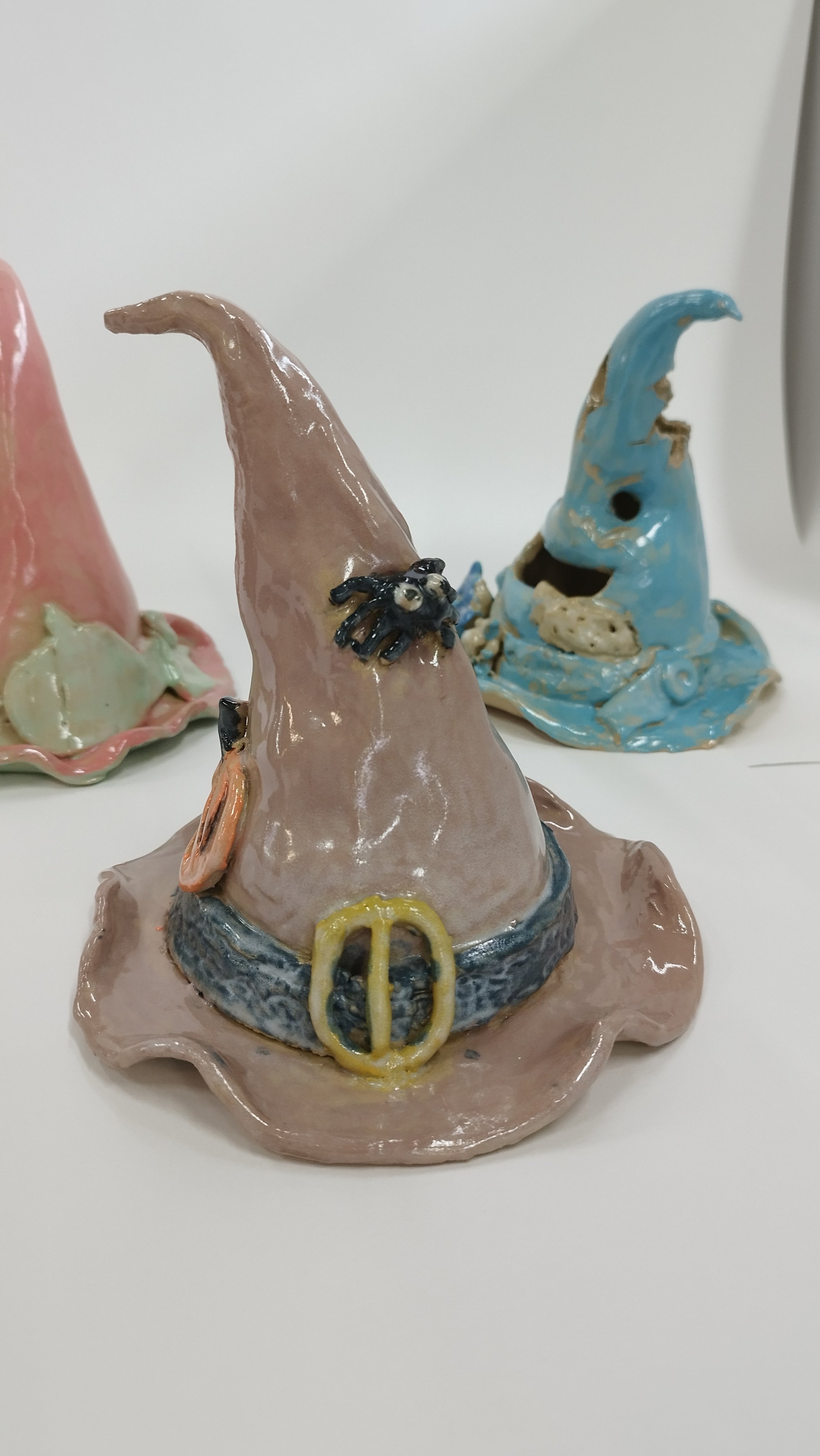 Ceramic witch hats with decorative elements