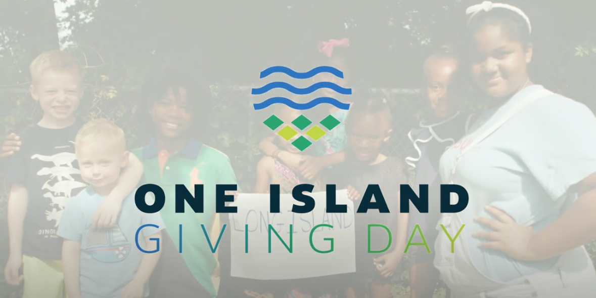 Children posing outdoors with "One Island Giving Day" text overlay.