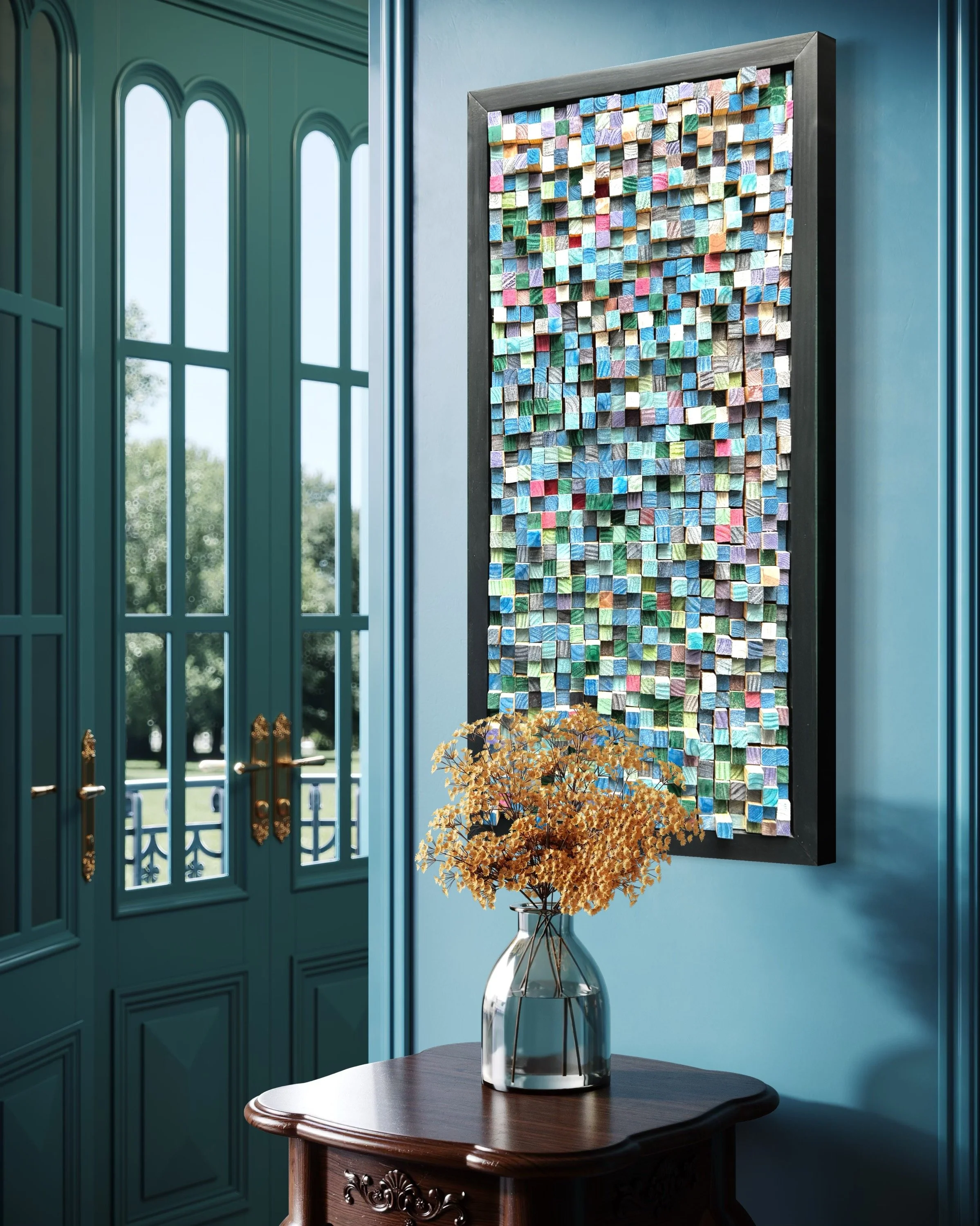 A colorful mixed media artwork with small, textured squares on a blue wall, a vase with dried orange flowers on a wooden table, and a green door with window panes leading outside.