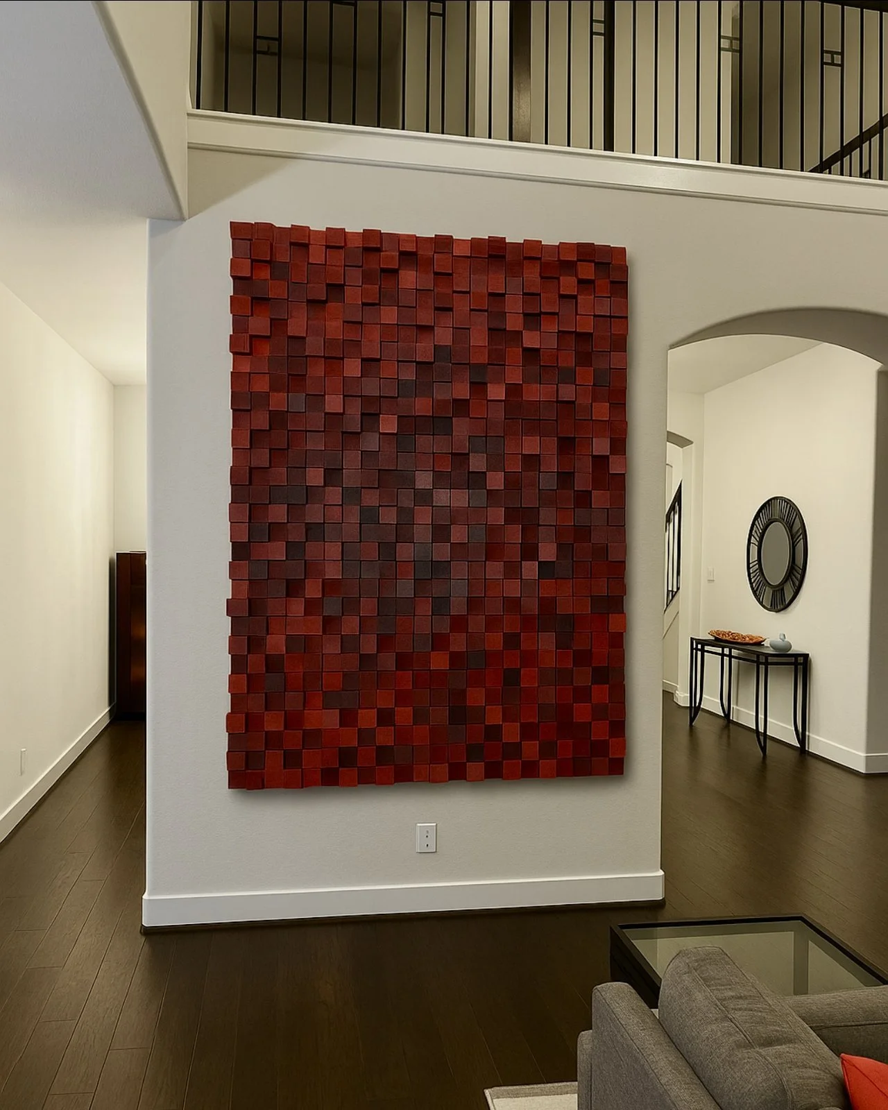 Slow Burn, a large red wood block wall piece in a two-story living room