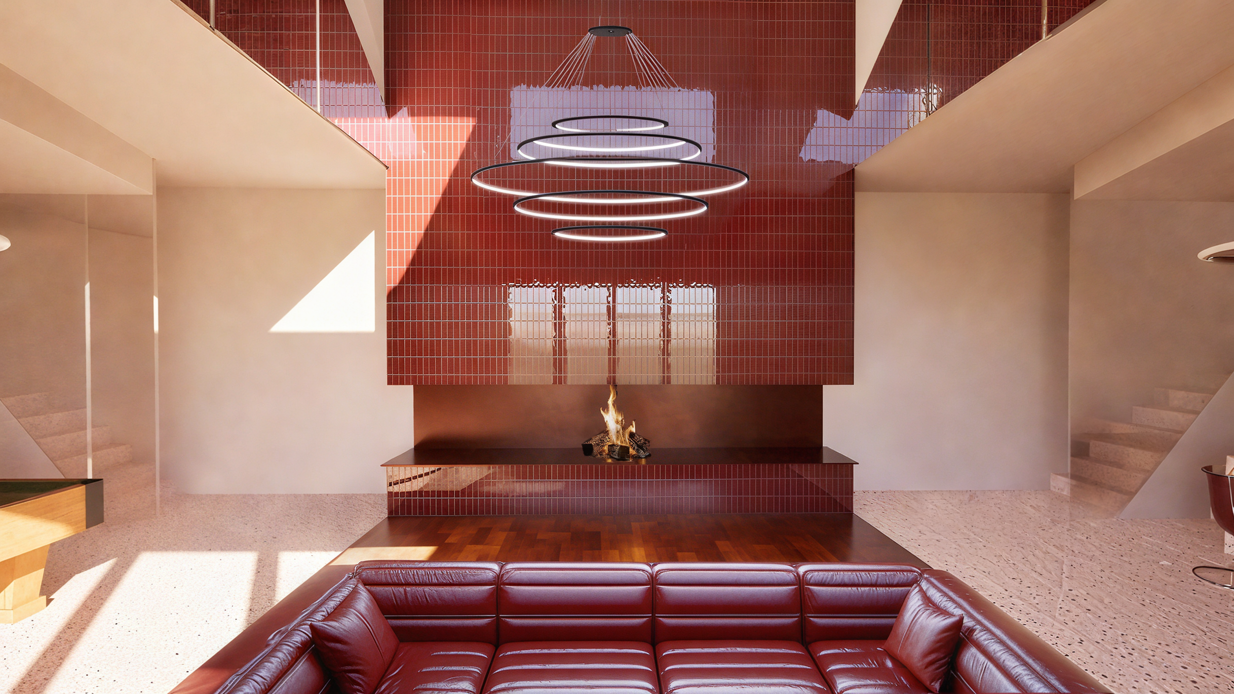 Salon moderne avec cheminée, canapé en cuir rouge, mobilier minimaliste, mur en tuiles rouges, éclairage design contemporain, escalier en béton et sol en terrazzo.