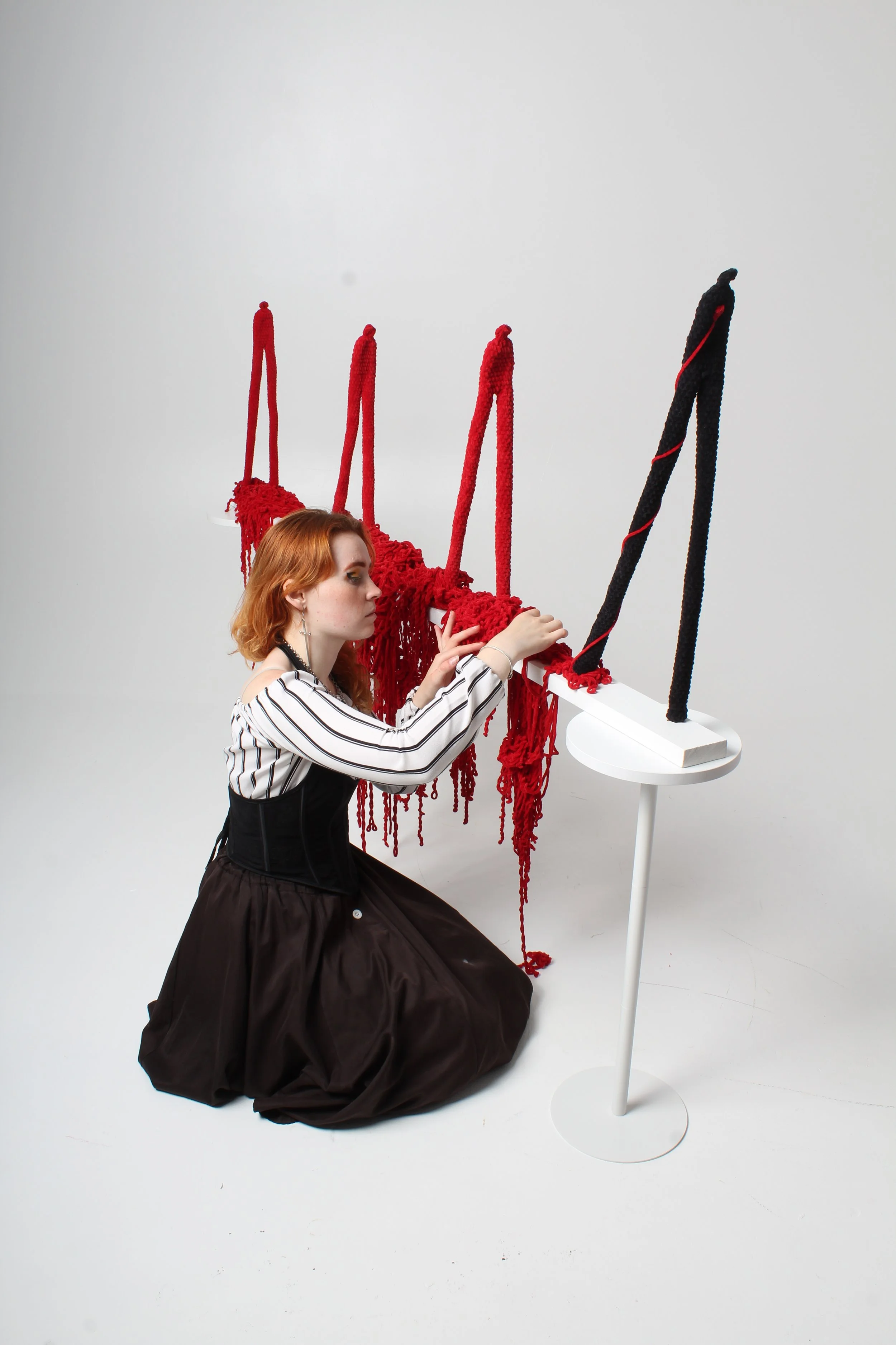 Ceris Dyfi Jones, textile artist, working on a sculpture named 'Yr Hyn Sy'n Dilyn / What Follows' to be exhibited in Caernarfon Castle as part of her Heartstrings crochet series.