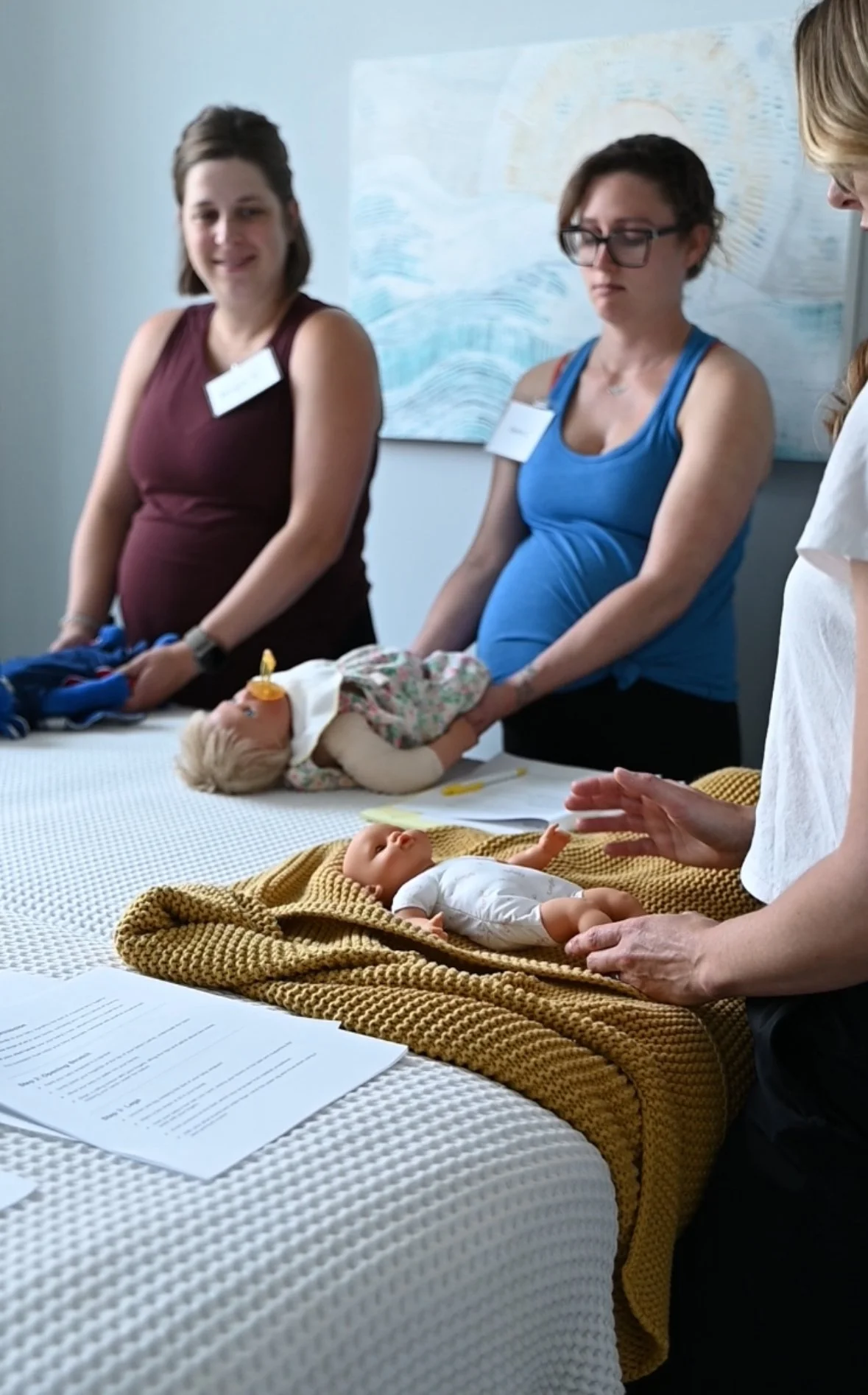 Infant Massage demonstration at our Perinatal Wellness Day Retreat with Marilyn Glinka LMBT and owner of Arches Bodywork.