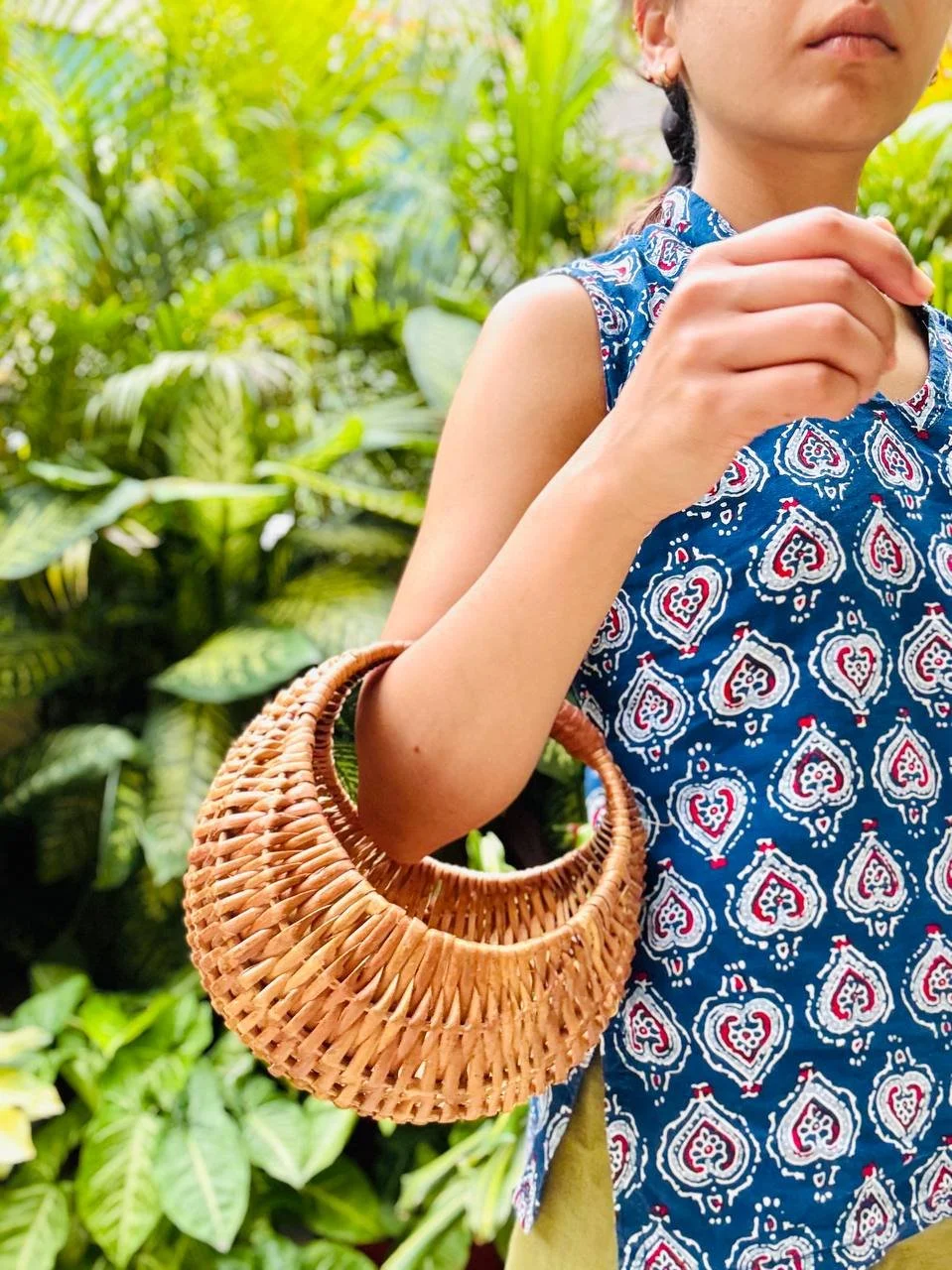 handwoven_bamboo_moon_bag_in_hand.jpg