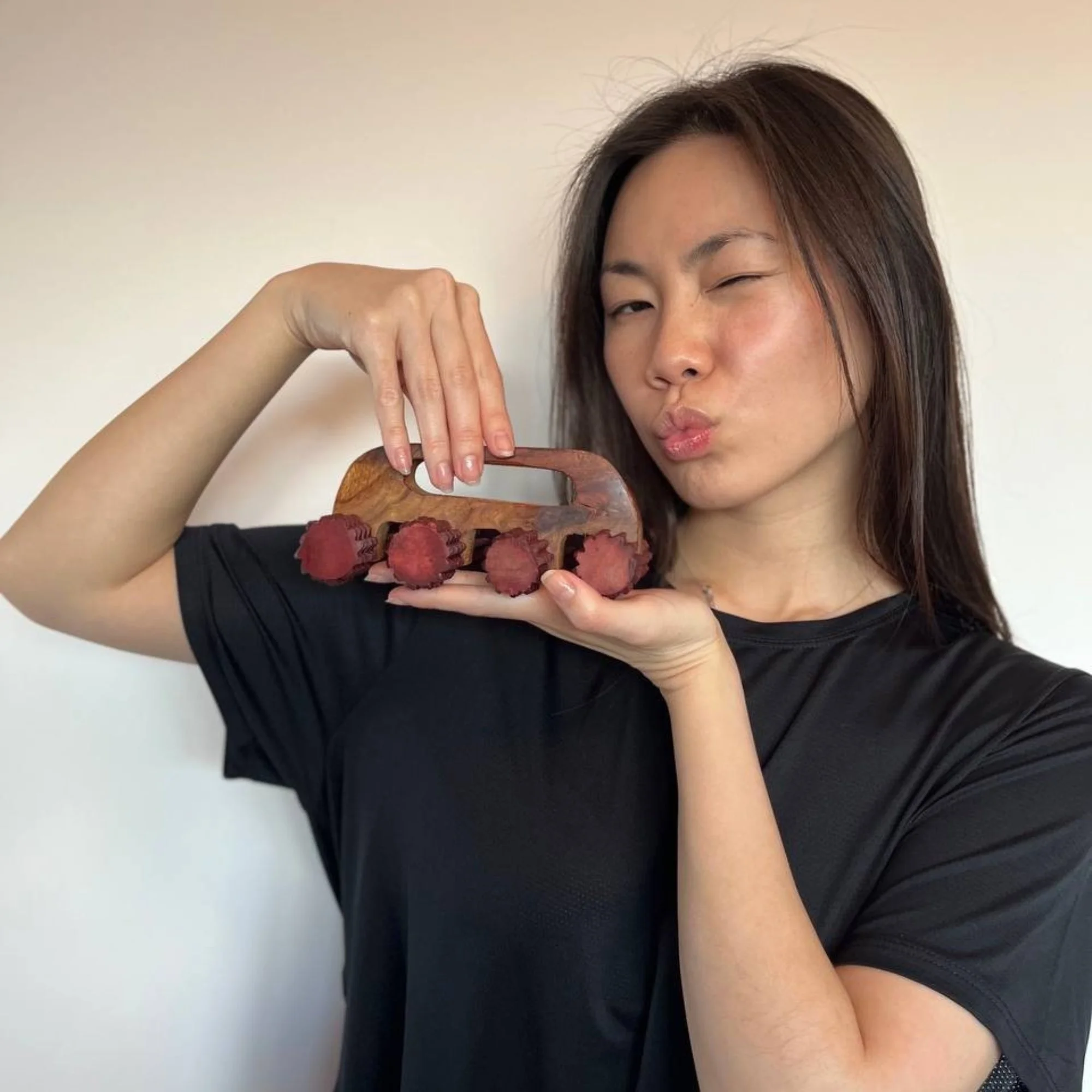 Handheld_wooden_deep_tissue_massager_lifestyle_shot.jpg