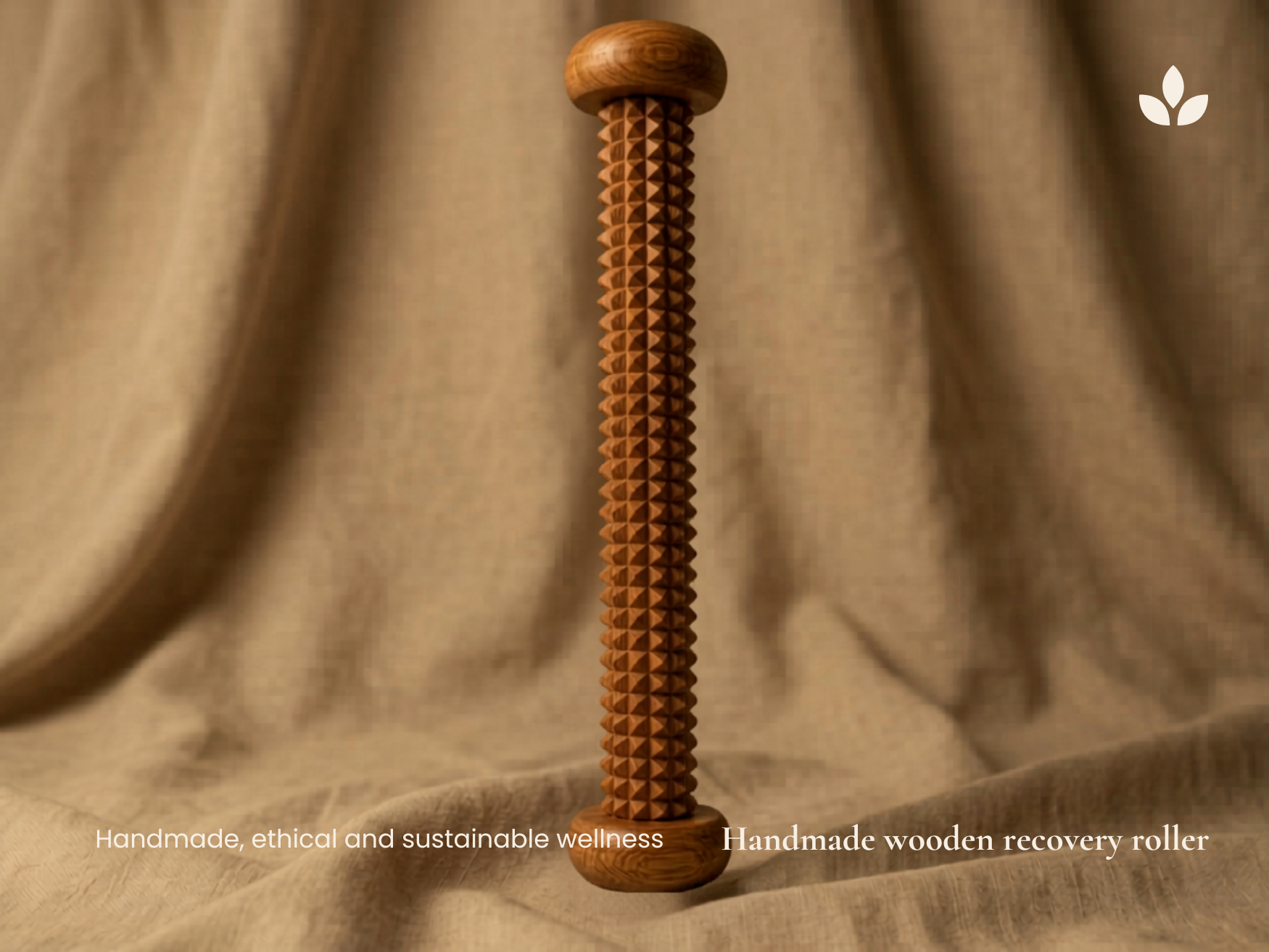 Handmade wooden recovery roller standing on natural fabric with warm wooden finish