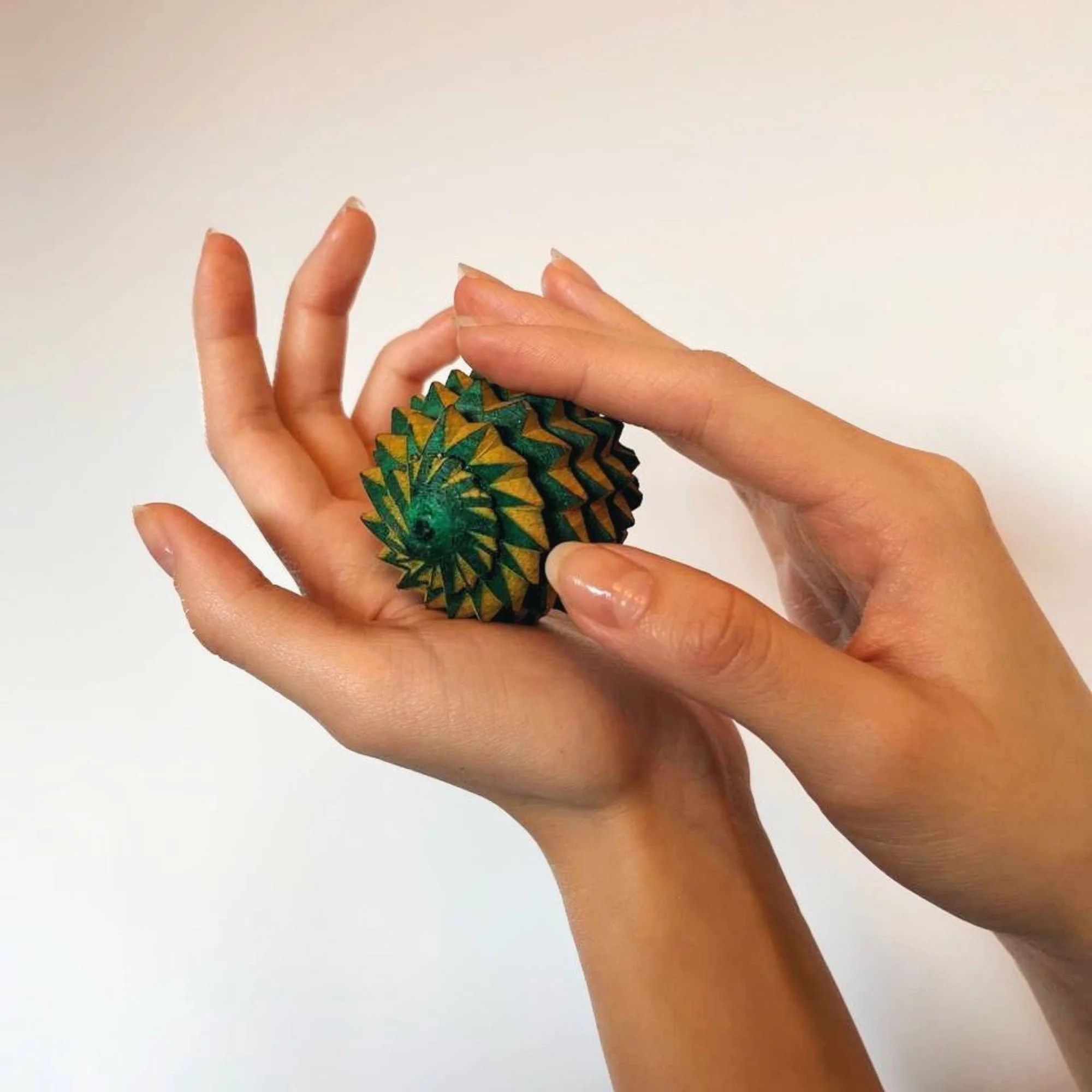 Wooden_reflexology_ball_lifestyle_in_hand.jpg