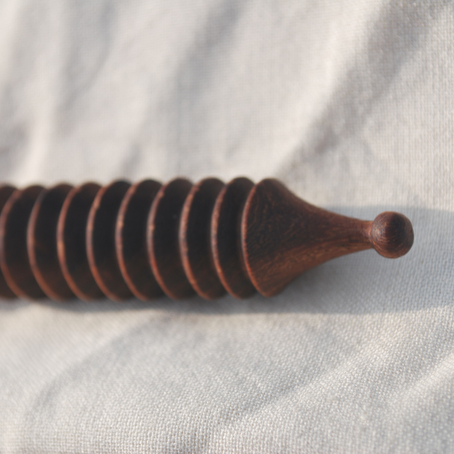 wooden-body-acupressure-massage-tool-texture-closeup.png.png