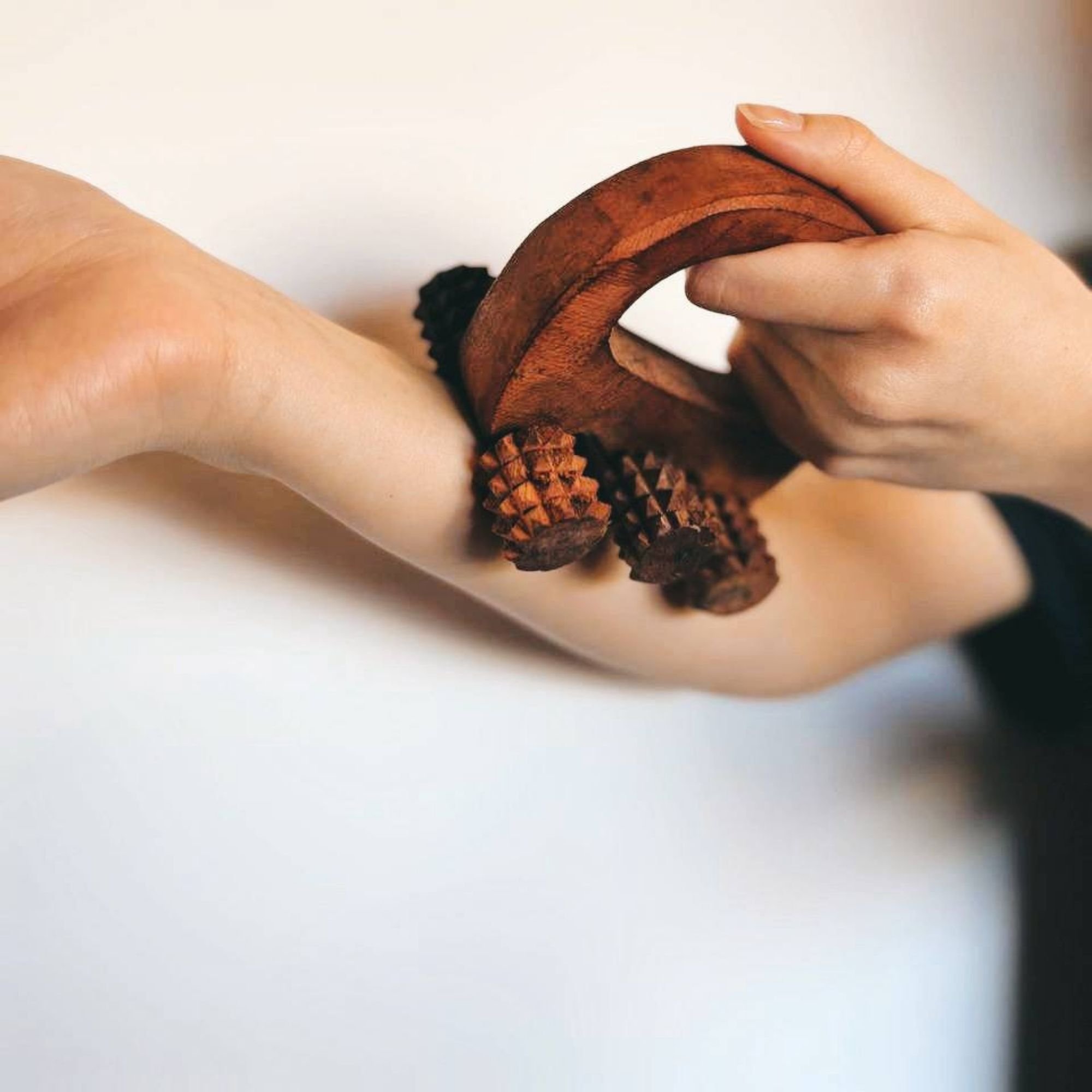 Handheld_wooden_body_massage_roller_arm.jpg